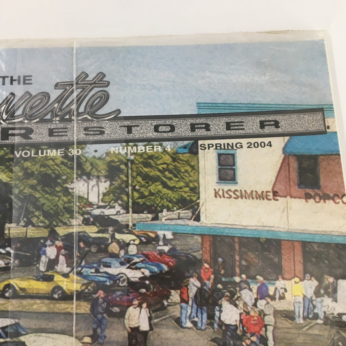 Close-up view of The Corvette Restorer Magazine Spring 2004 Vol. 30 #4 title, highlighting the magazine's branding and association with the Corvette community.