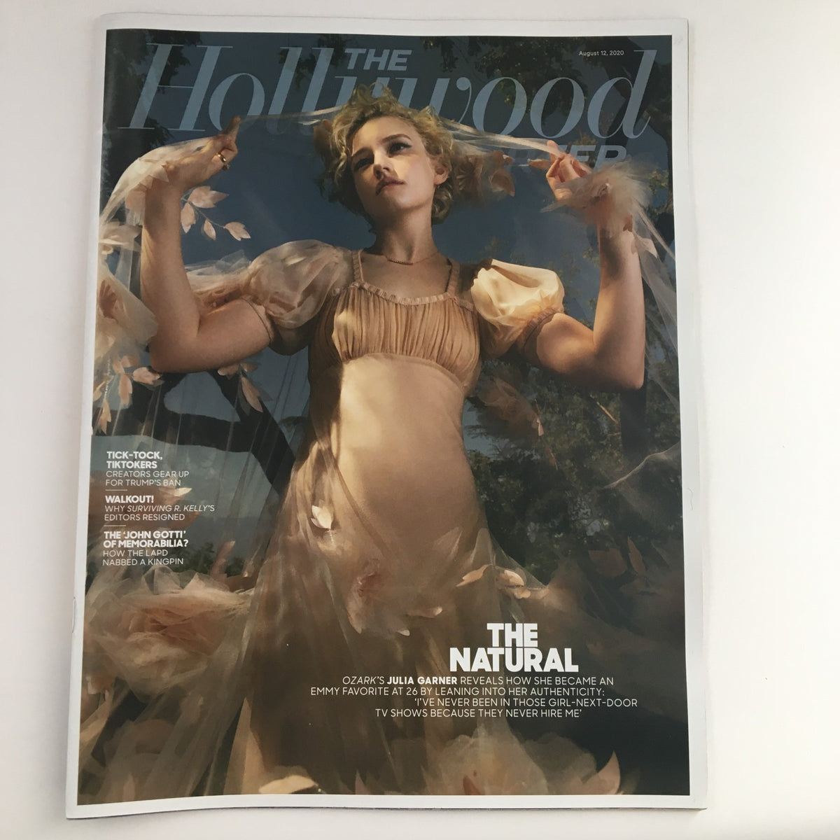 The Hollywood Reporter magazine cover from August 12, 2020 featuring Ozark actress Julia Garner in a captivating editorial shoot, showcasing her in a delicate dress surrounded by flowing fabric.