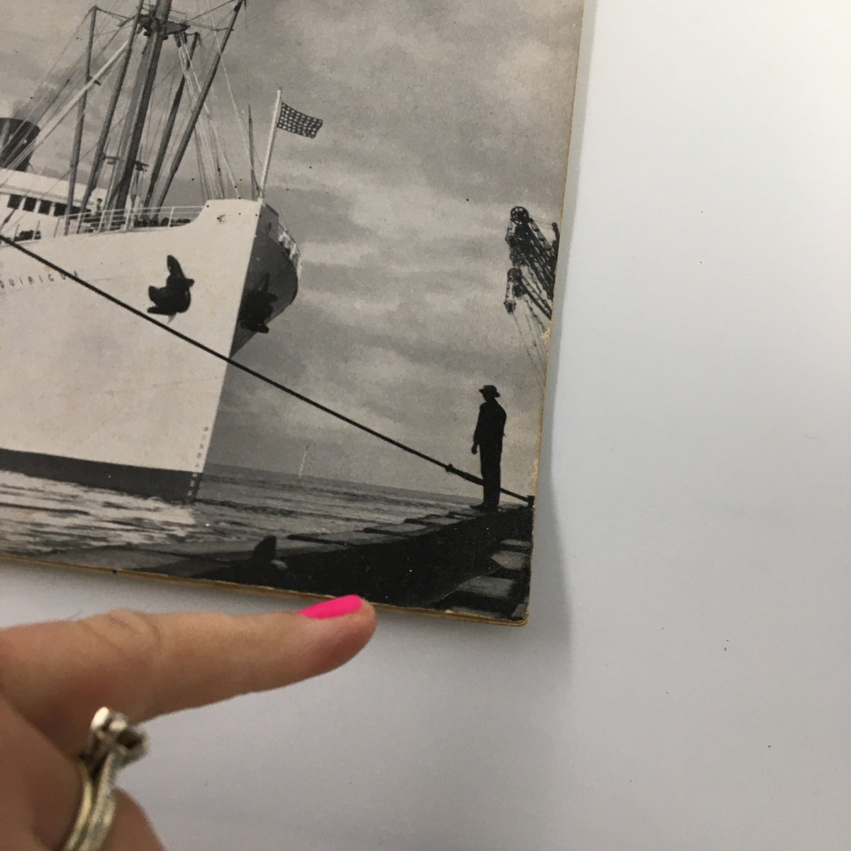 Close-up of the magazine cover 'Ships and Sailing' from May 1952, highlighting the United Fruit Company's ship and a dock worker in silhouette.