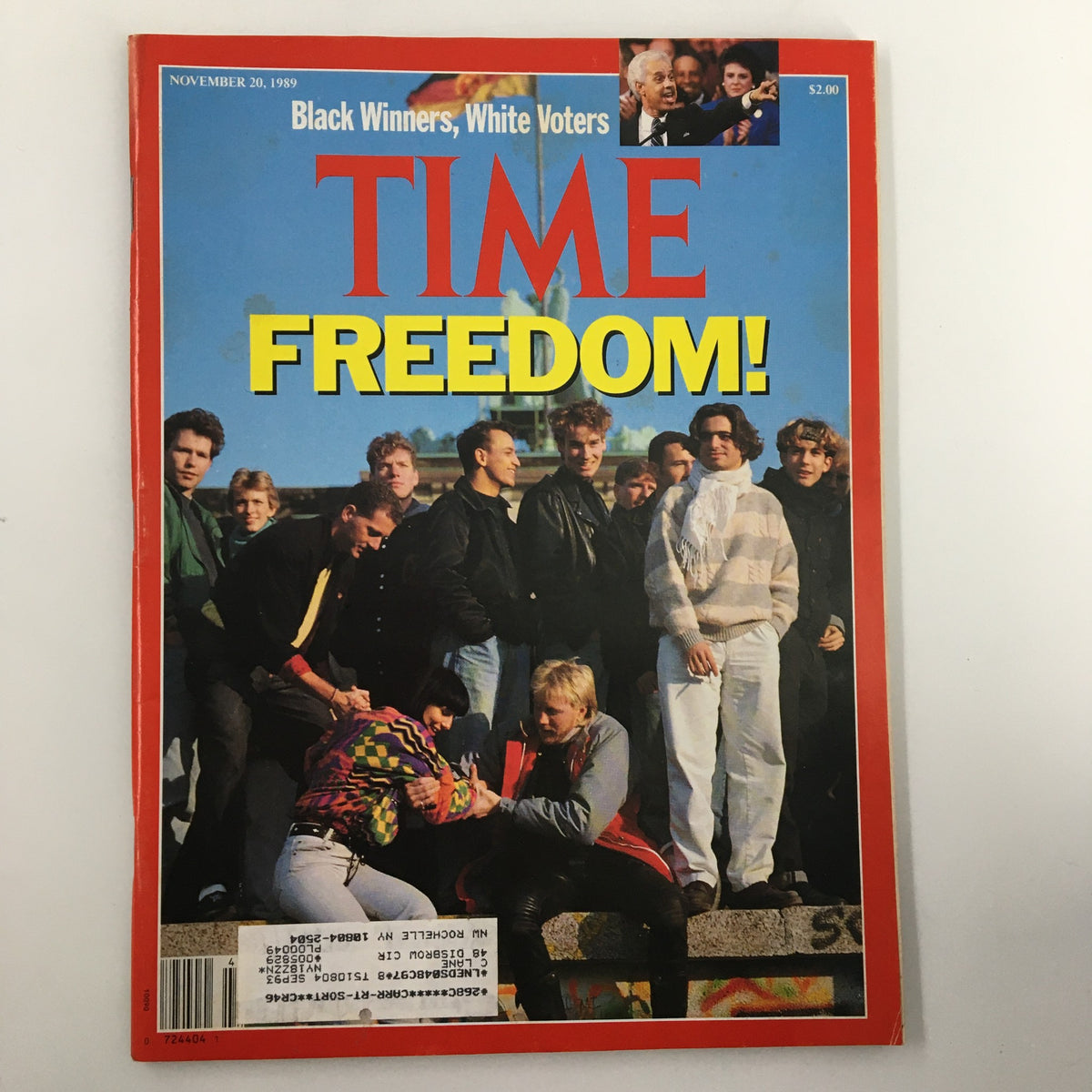 Cover of the November 20, 1989 issue of Time Magazine titled 'Black Winners, White Voters and Freedom', featuring a vibrant photograph of diverse individuals gathered together, highlighting themes of race and democracy.