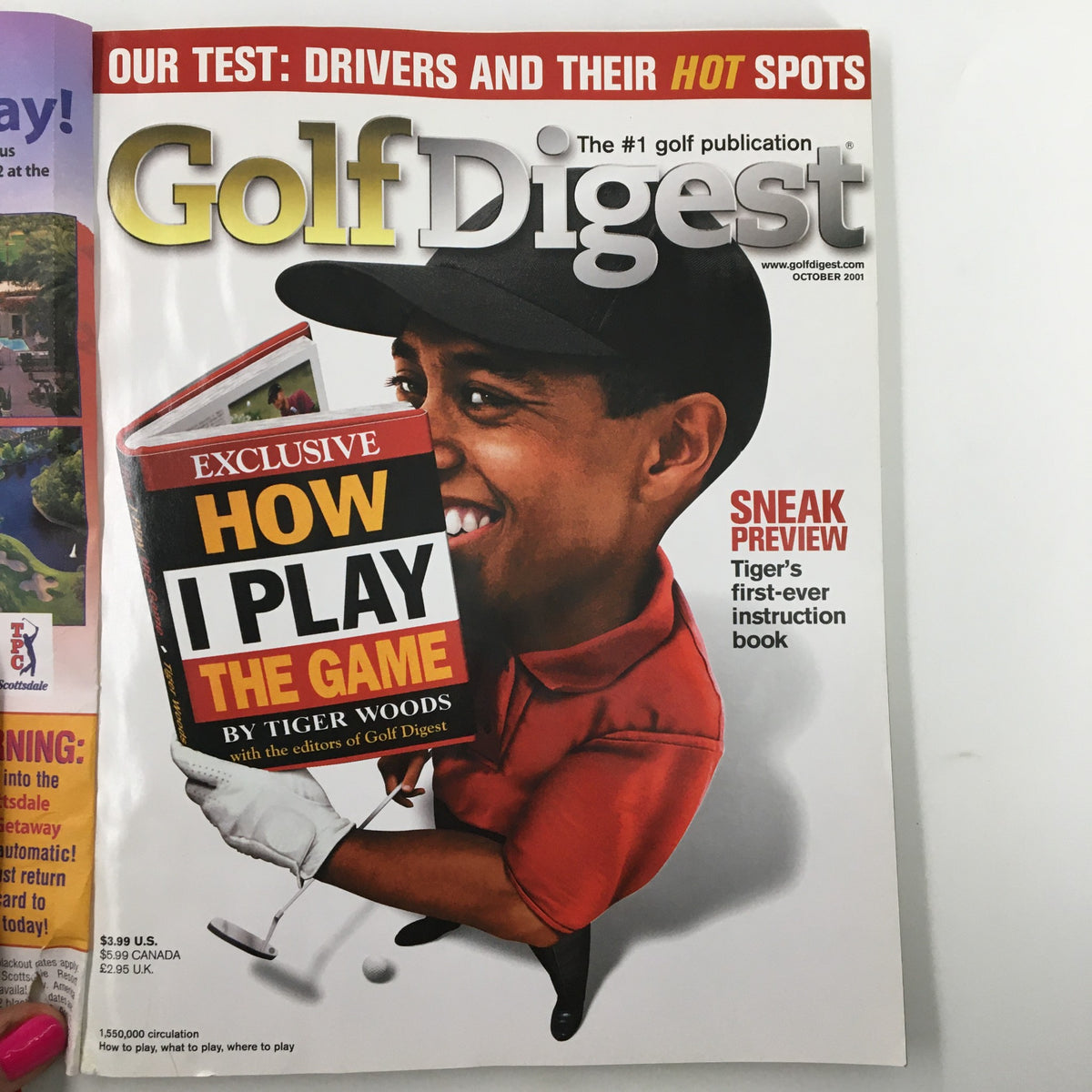 Golf Digest Magazine October 2001 cover featuring Tiger Woods holding a book titled 'How I Play The Game', showcasing striking graphics and the magazine's identity as the #1 golf publication.