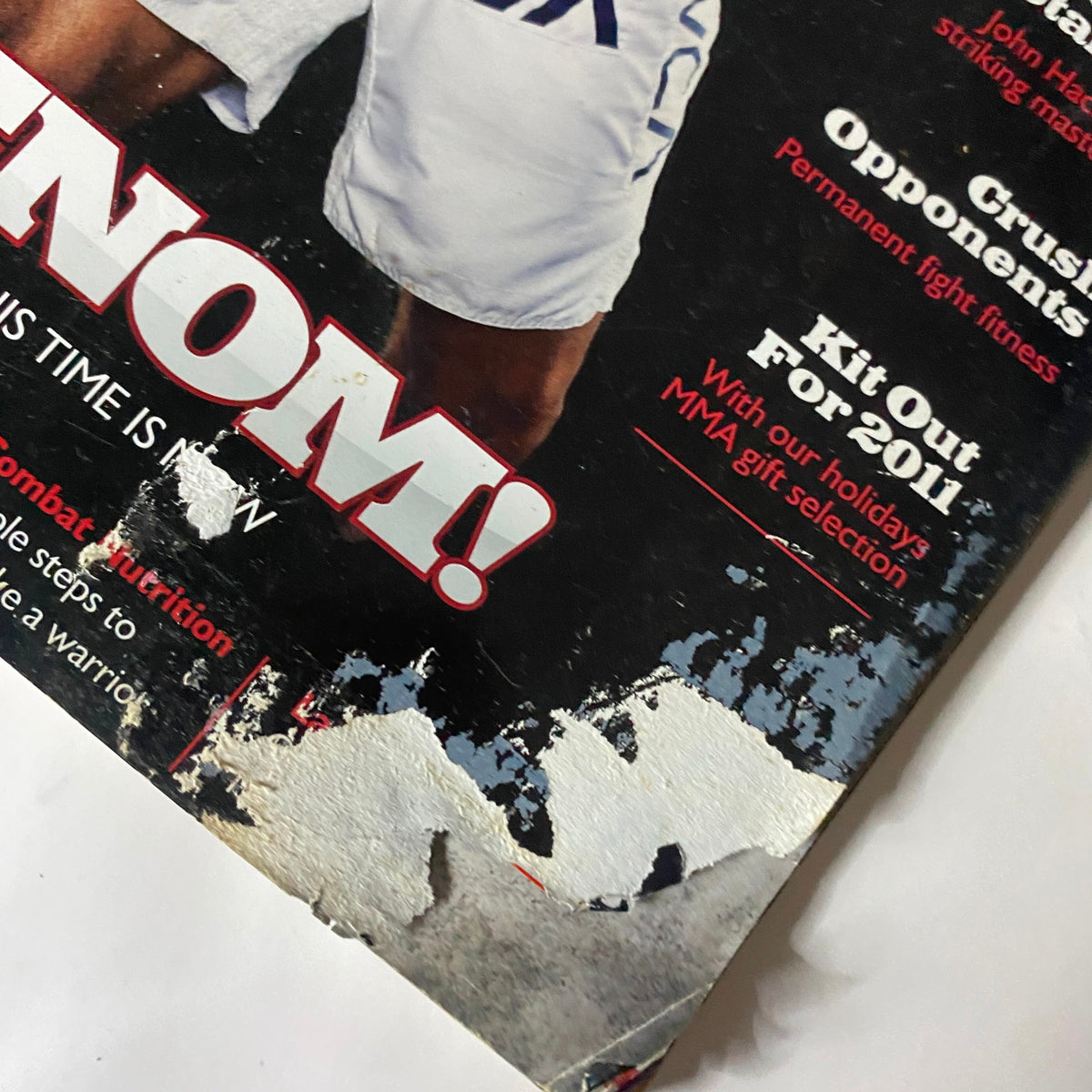 Close-up of the Fighters Only US Magazine December 2010 cover showcasing wear and tear, emphasizing the collectible nature of this vintage magazine featuring Vitor Belfort.
