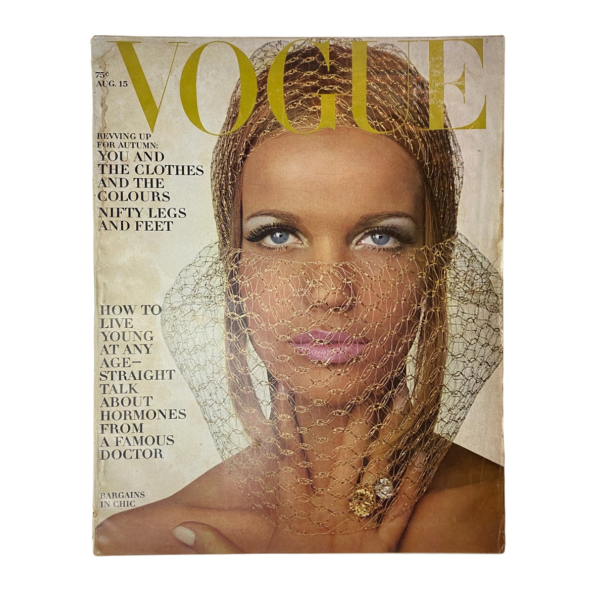 Vogue Magazine August 15, 1965 cover featuring supermodel Veruschka von Lehndorff, showcasing mid-60s fashion with a striking evening beauty look including silver shimmer lids and a silver snood. This vintage magazine captures the elegance and cultural trends of the era.