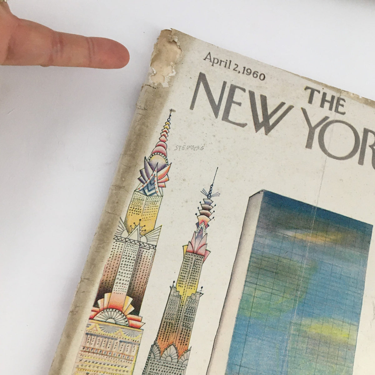 Close-up of The New Yorker Magazine April 2, 1960 cover, highlighting Saul Steinberg's distinctive illustrations of New York's architecture and skyline.