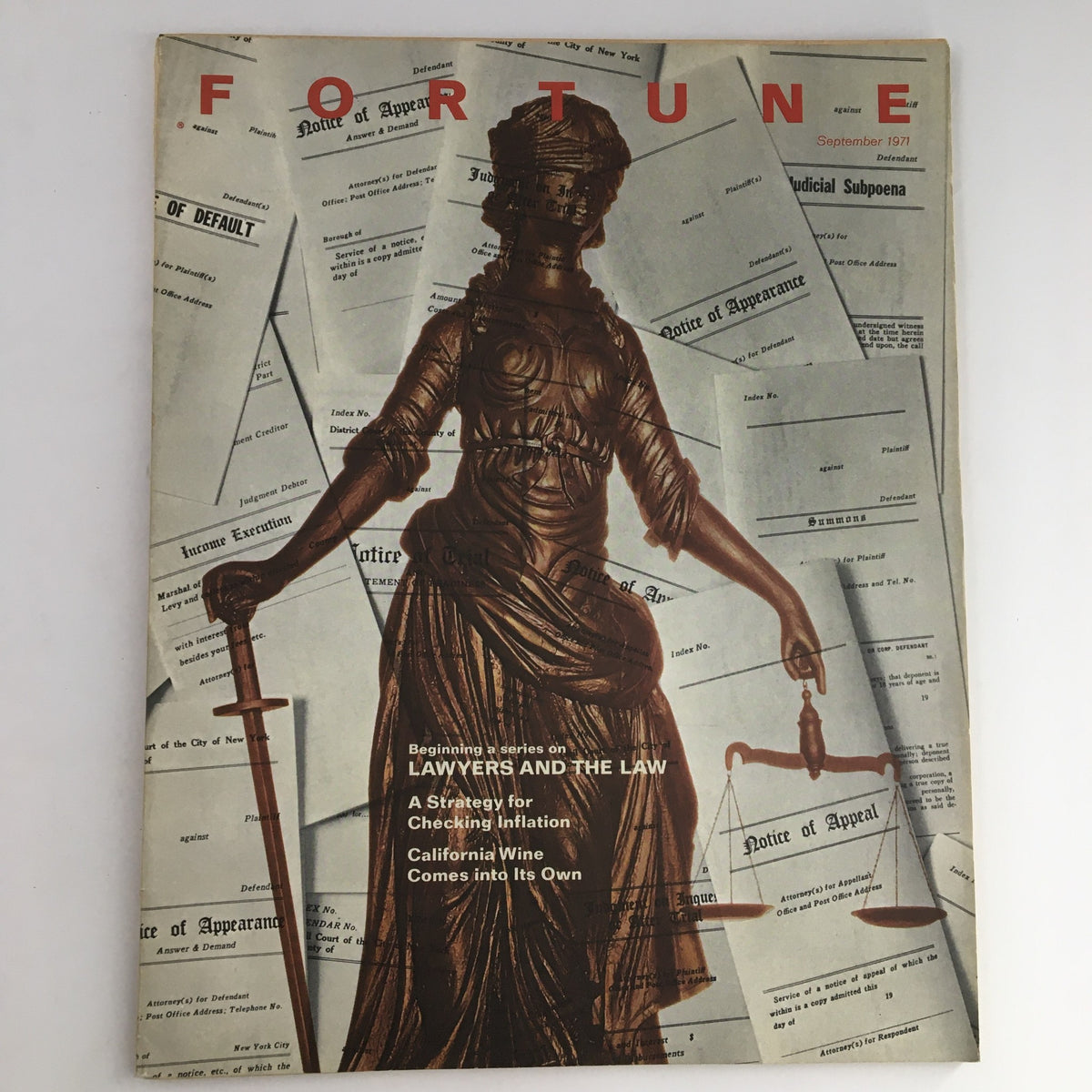 Fortune Magazine September 1971 cover featuring the title 'A Strategy for Checking Inflation' with a statue of Lady Justice amidst legal documents and headlines emphasizing economic themes.
