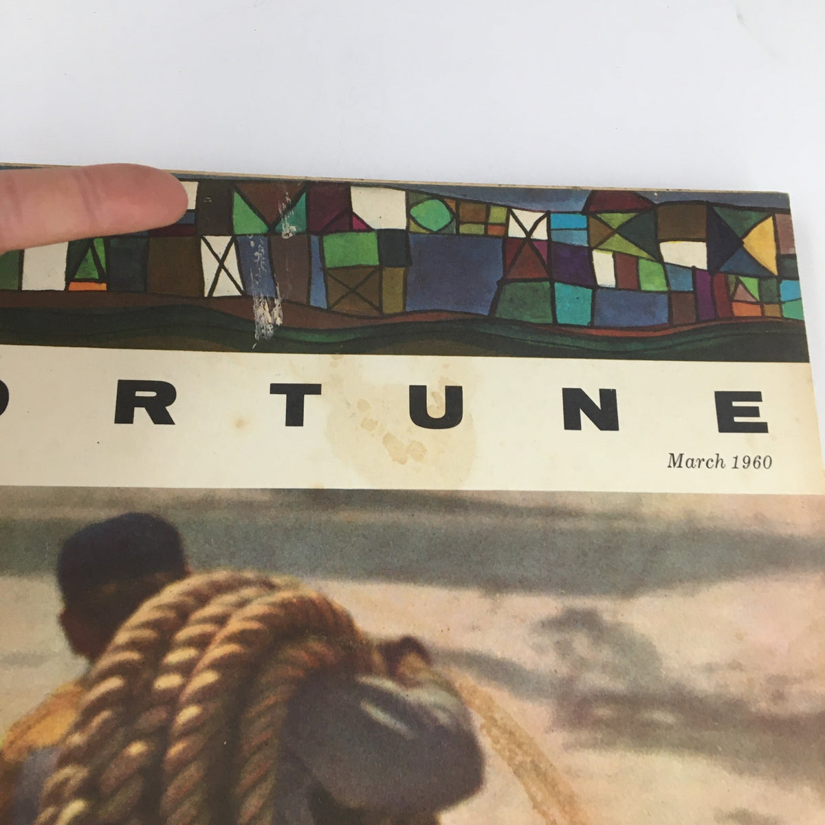 Detailed view of the top section of the March 1960 Fortune Magazine cover, illustrating the colorful design and text, relevant to the feature on George T. Baker's Feud with the World.