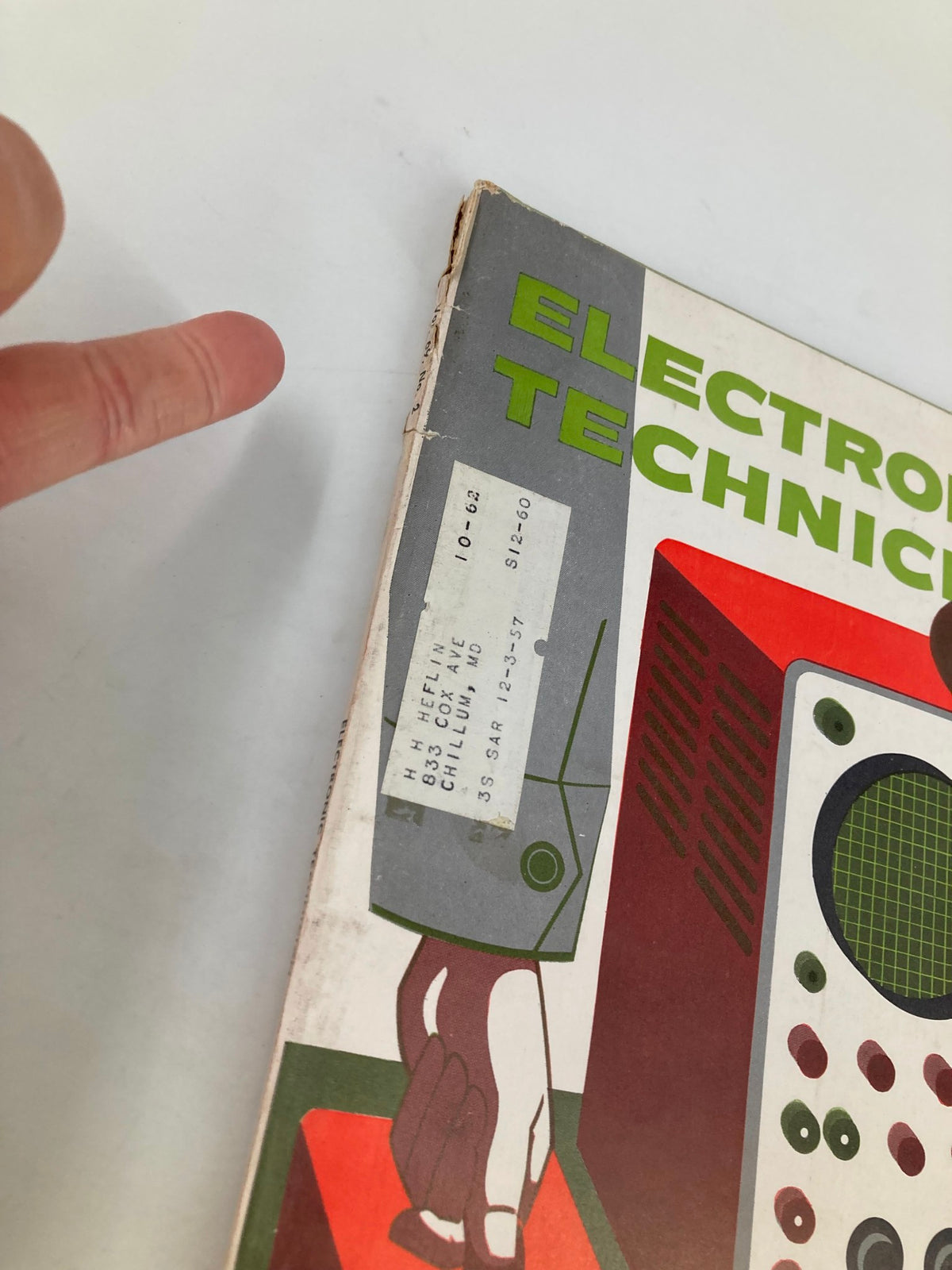 Close-up of the spine of VTG Electronic Technician Magazine February 1959 showing the vintage label and wear, indicative of its age and history.