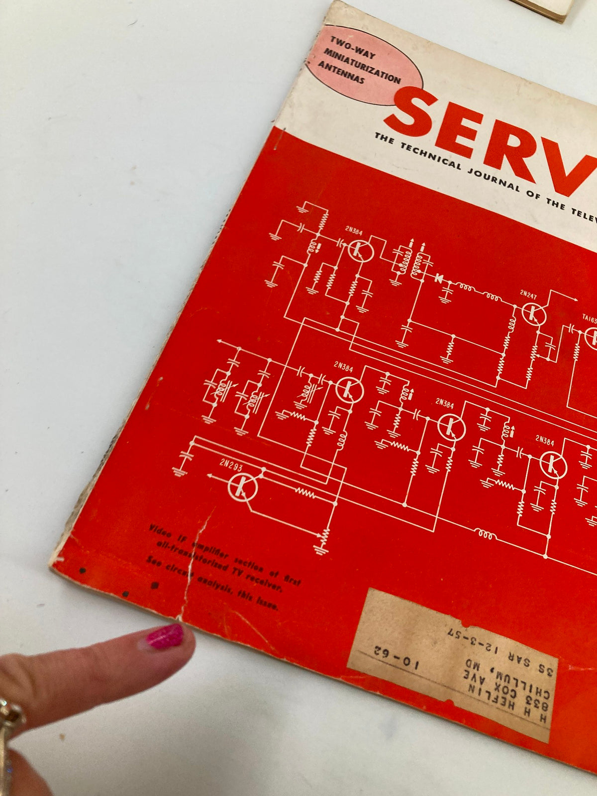 Close-up view of VTG Service Magazine September 1958 cover with highlighted circuit diagrams and minor wear visible, showcasing its vintage authenticity.