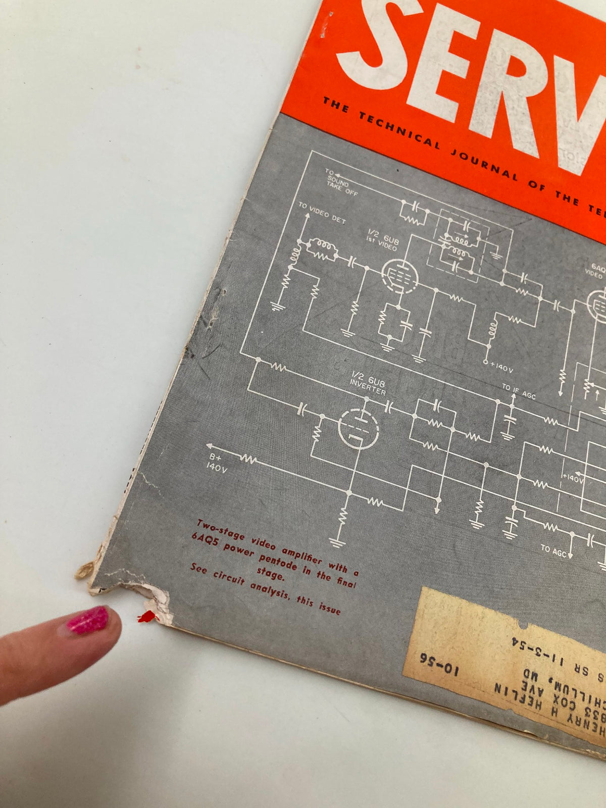 Close-up of the damaged edge of the VTG Service Magazine September 1956, highlighting wear and historical character associated with its age.