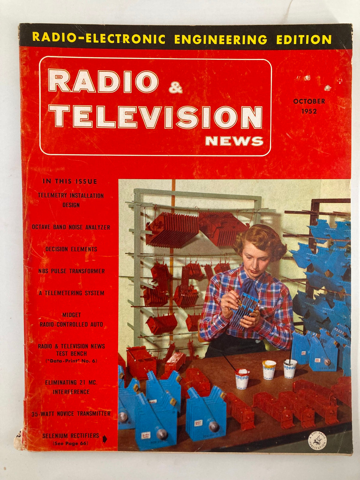 Cover of VTG Radio & Television News Magazine October 1952 featuring a woman assembling electronic components with colorful devices, showcasing technology from the 1950s.