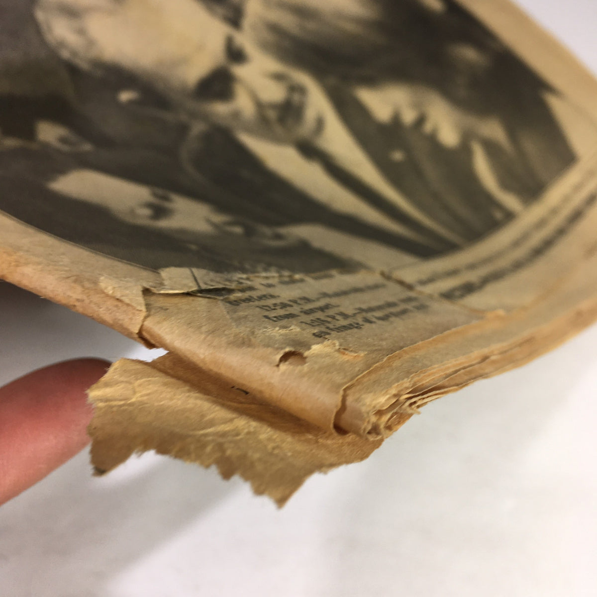 Close-up of the edge of the VTG Daily News Newspaper from November 23 1963, showing minor wear and paper damage, maintaining historical significance related to Lyndon Johnson and JFK.