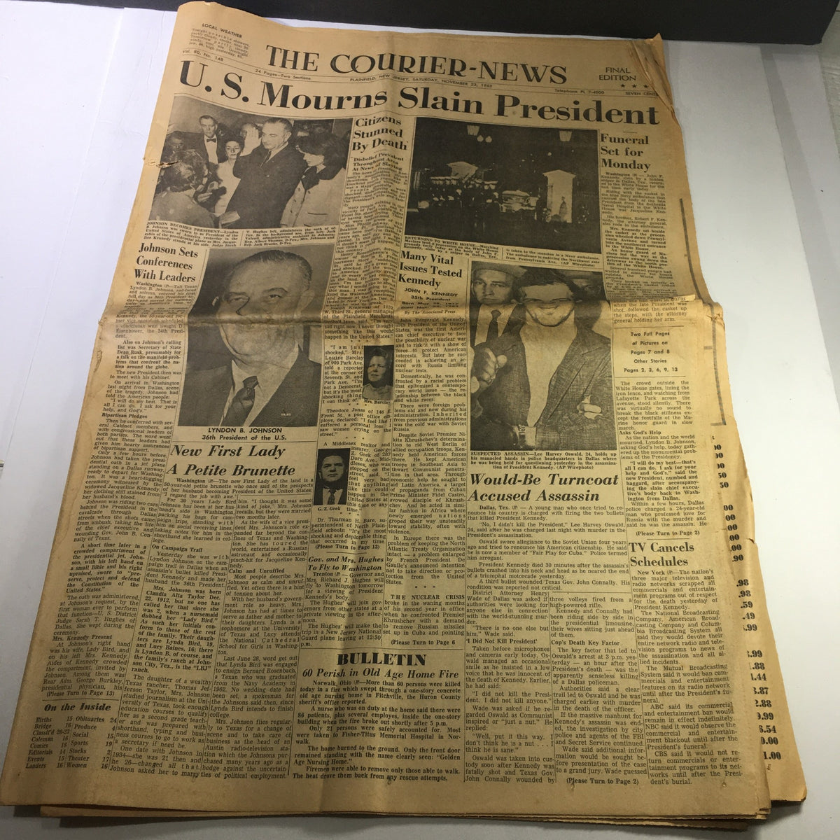 VTG The Courier-News Newspaper from November 23, 1963, featuring the headline 'U.S. Mourns Slain President'. The front page includes articles about Lyndon B. Johnson, President of the U.S., and the new First Lady. The newspaper contains historical news events surrounding the assassination of President Kennedy with images and coverage of public reactions.