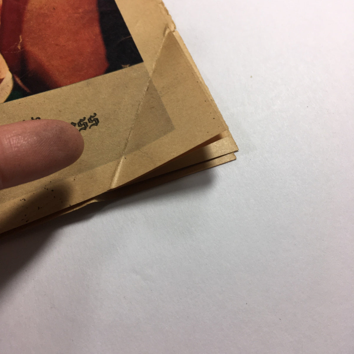 Condition details of the VTG Long Island Press Newspaper April 7 1968, highlighting the corner wear and creases.