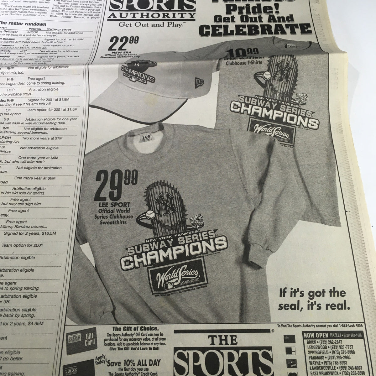 The Star-Ledger Newspaper from October 29, 2000 showcasing merchandise for the Subway Series Champions, including t-shirts and hats, celebrating the World Series event.