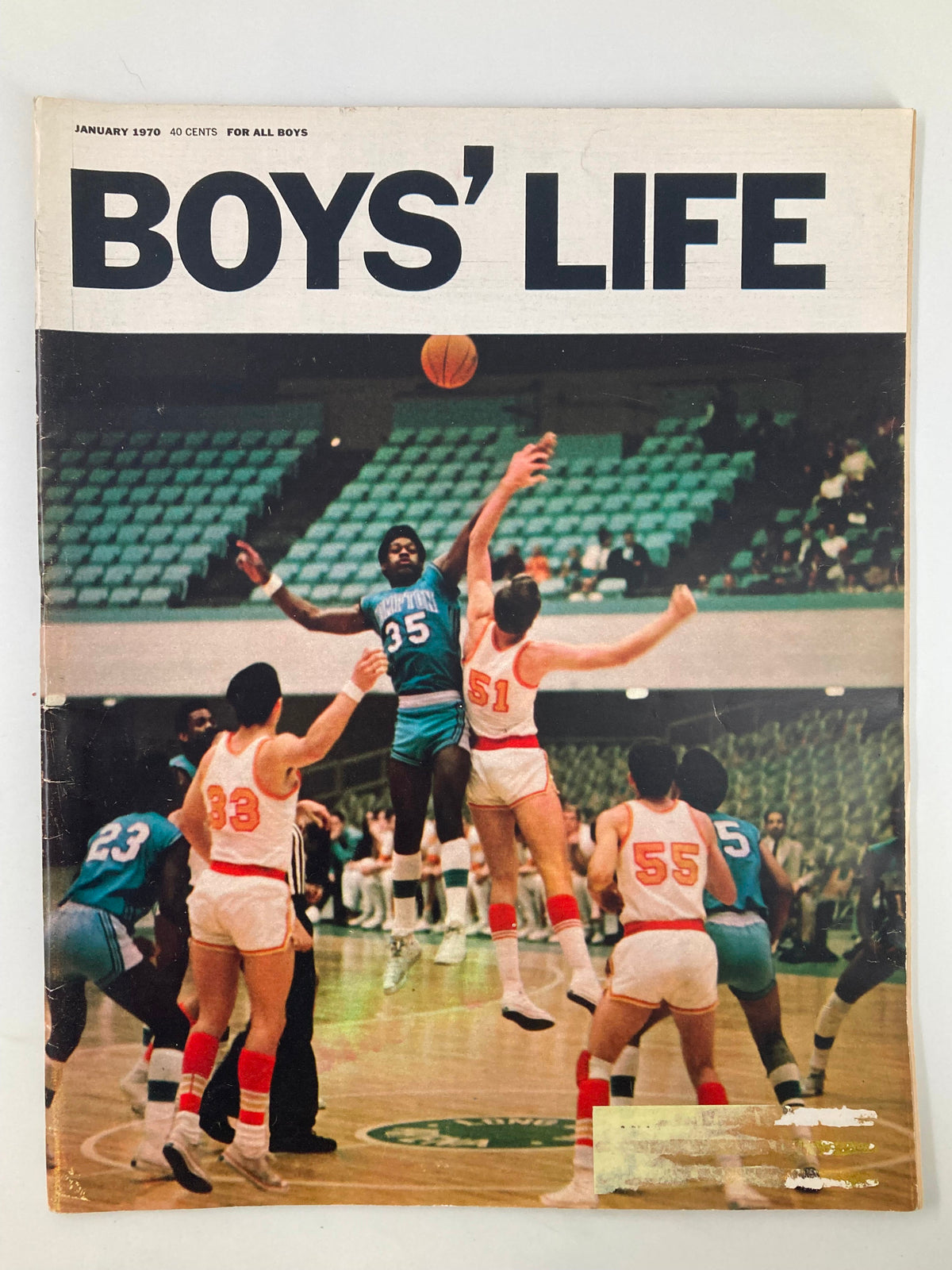 Boys' Life Magazine January 1970 cover featuring basketball players in action during a game, showcasing the vibrant and dynamic spirit of youth sports.