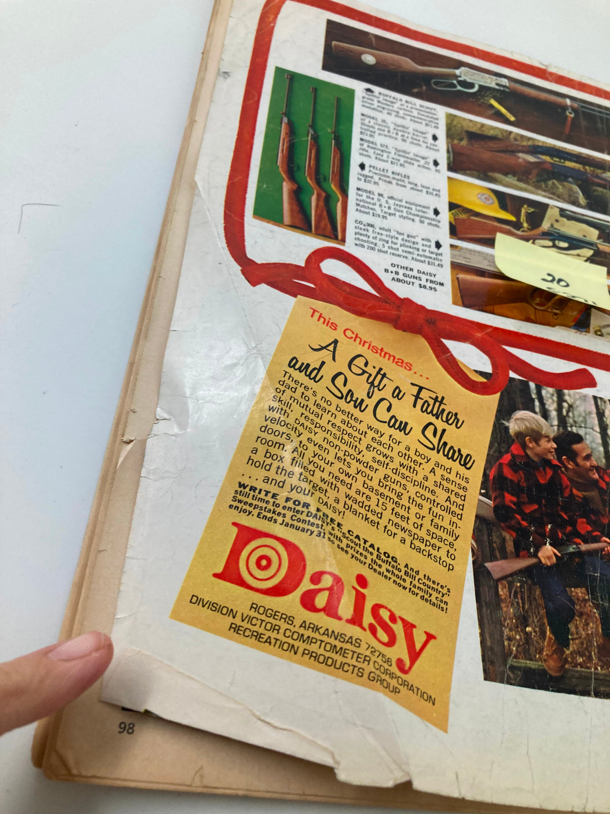Back cover of VTG Boys' Life Magazine December 1969 featuring a Christmas advertisement for Daisy rifles, indicating the nostalgic themes of gift-giving in the late 1960s.