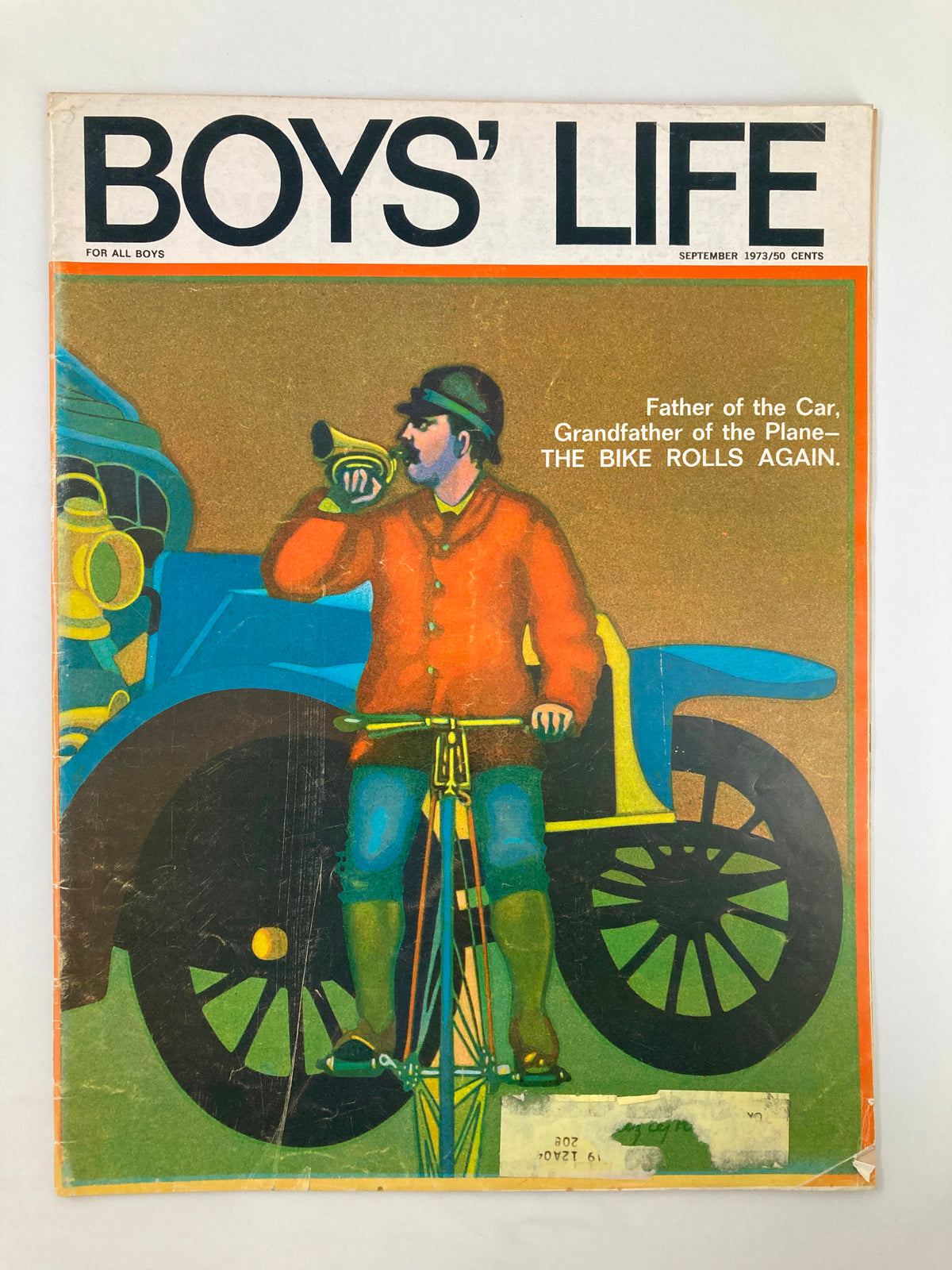 Boys' Life Magazine September 1973 cover featuring the title 'Father of the Car, Grandfather of the Plane' with an illustration of a cyclist playing a horn in front of a vintage car.