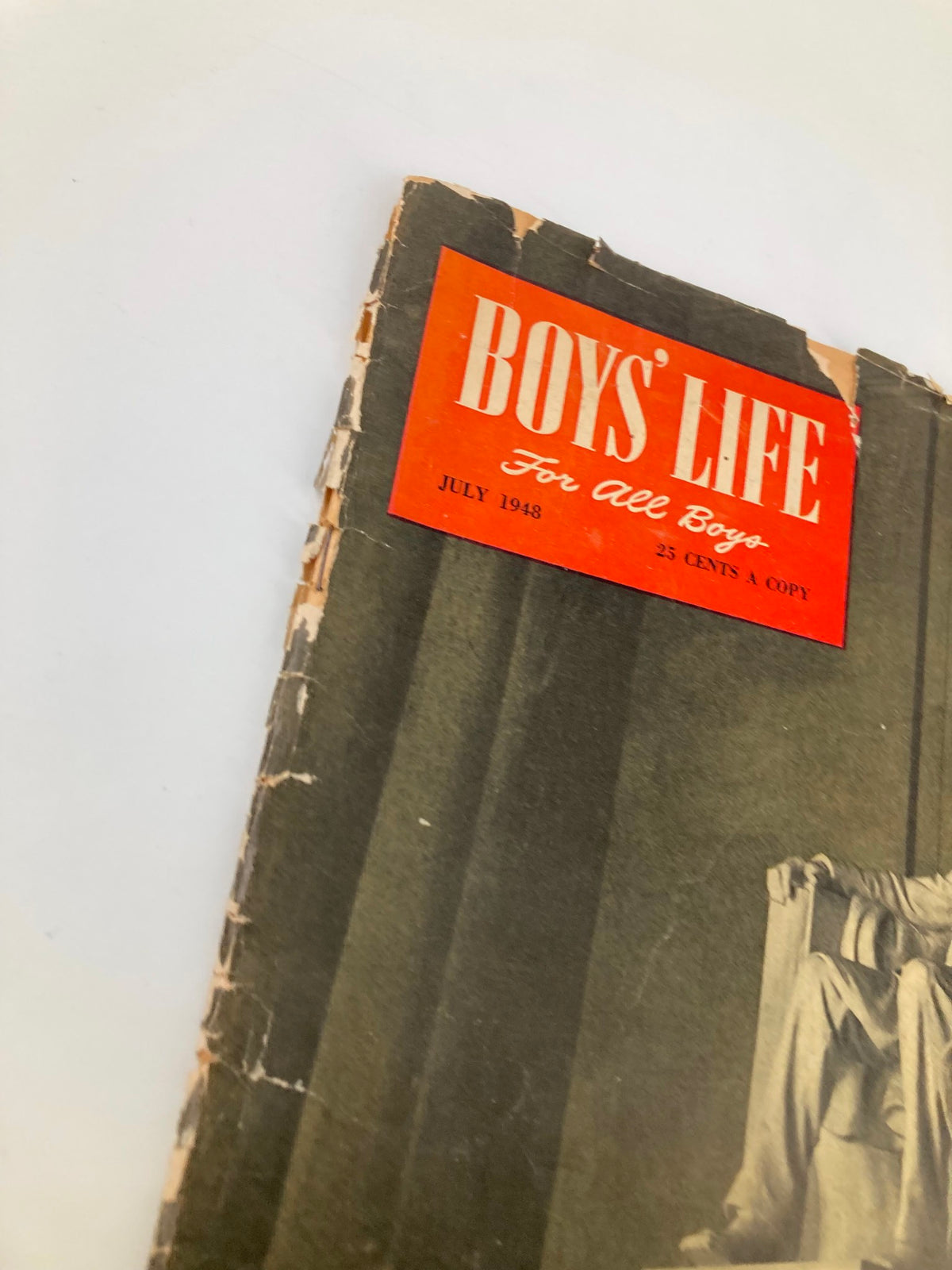 Close-up view of the July 1948 Boys' Life Magazine cover, highlighting the title and Lincoln Memorial, depicting the magazine's age and vintage condition.