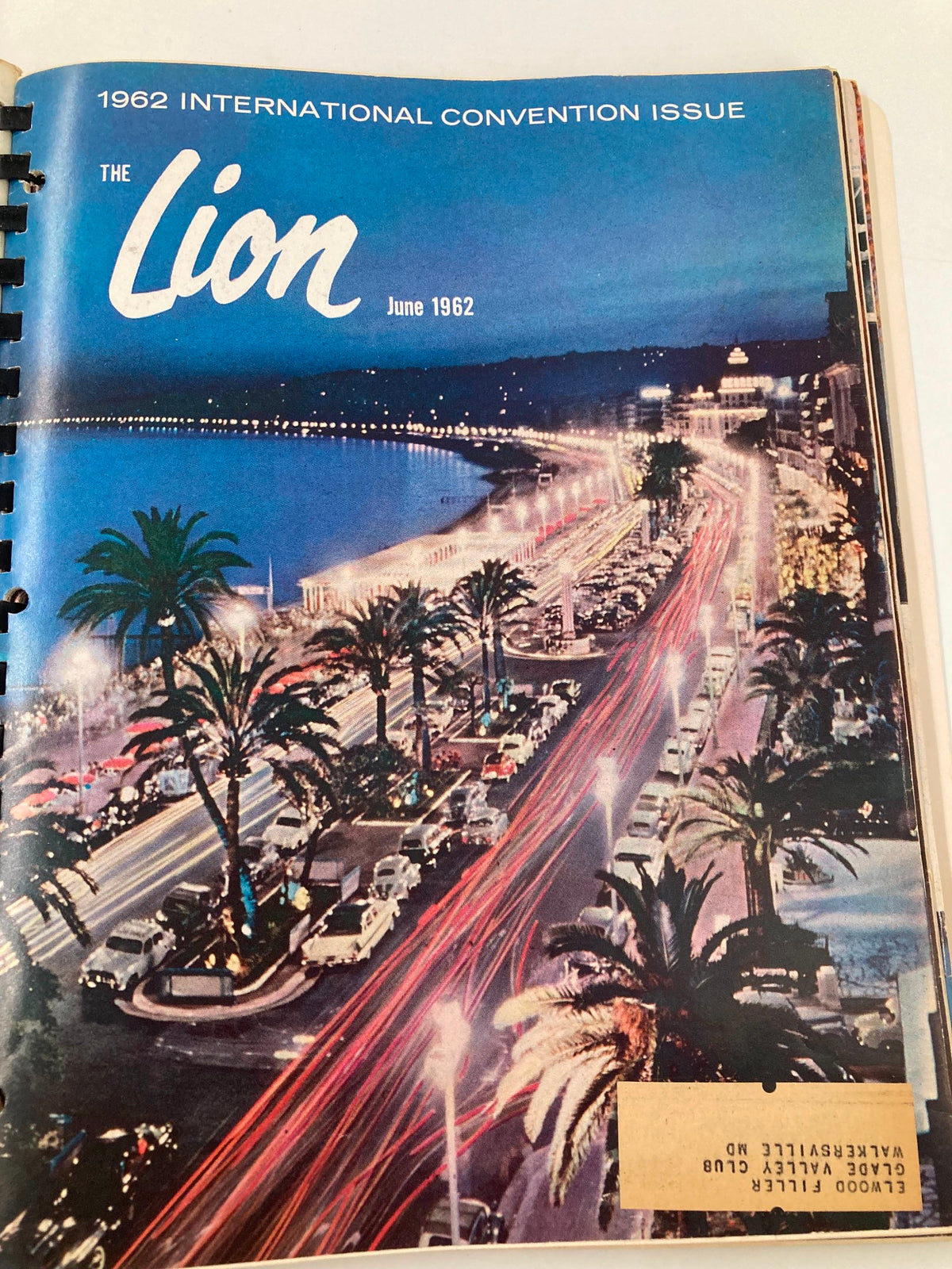 June 1962 International Convention issue cover of The Lion Magazine, featuring a vibrant cityscape at night with palm trees and car lights, capturing the essence of celebration.