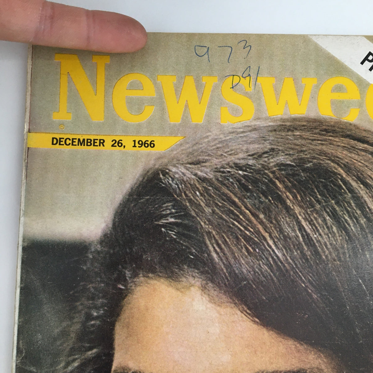 Close-up view of the cover of Newsweek Magazine dated December 26, 1966, highlighting Jacqueline Kennedy and the article 'The Death of a President'. The magazine features notable print details and a handwritten note in the corner.