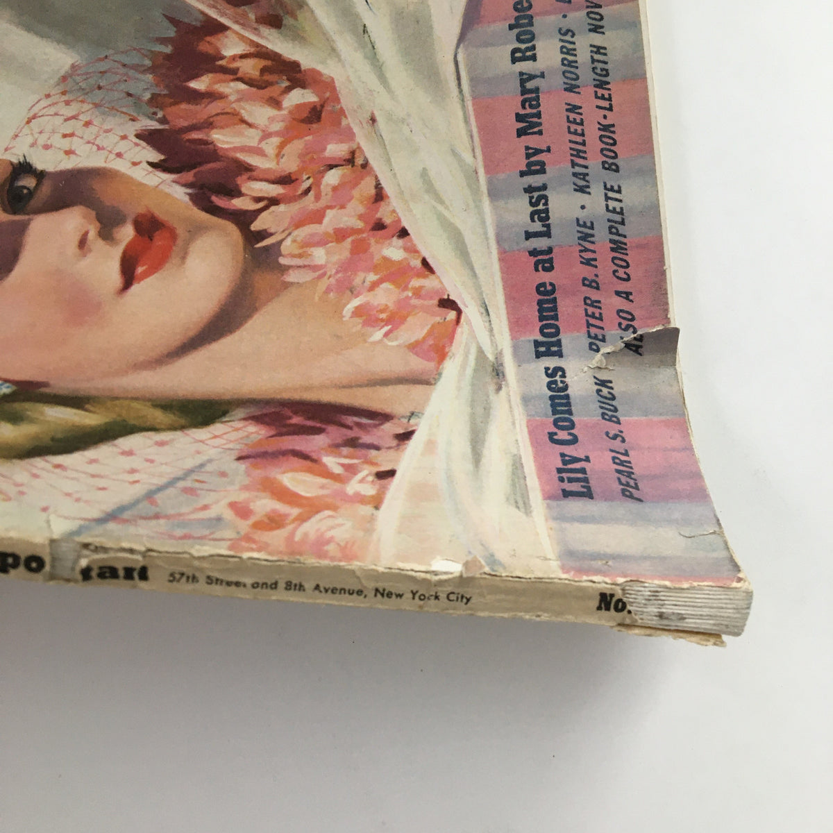 Detailed view of the cover of Cosmopolitan Magazine April 1940, showcasing the story 'Lily Comes Home at Last' by Mary Roberts Rinehart and the magazine's 1940s design elements.