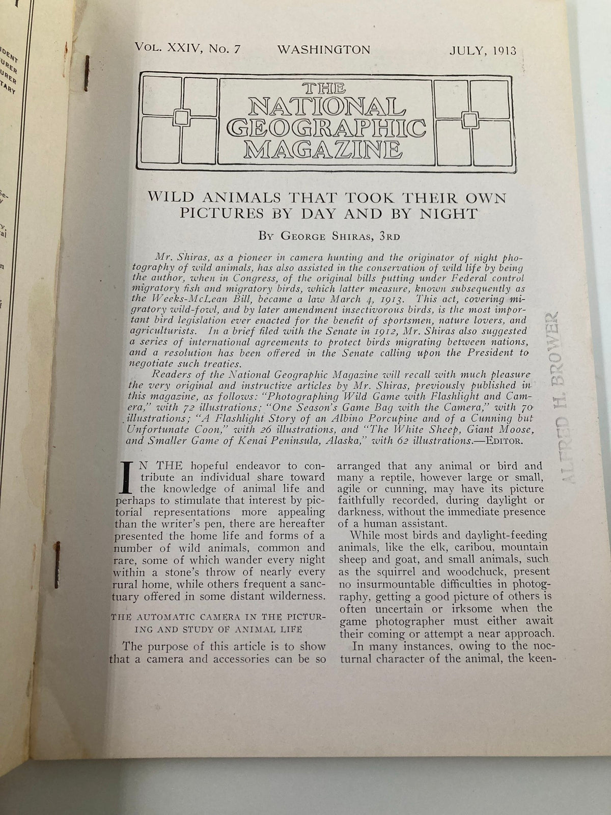 Interior page of the July 1913 National Geographic Magazine featuring an article on wild animals by George Shiras, emphasizing photography by day and night.