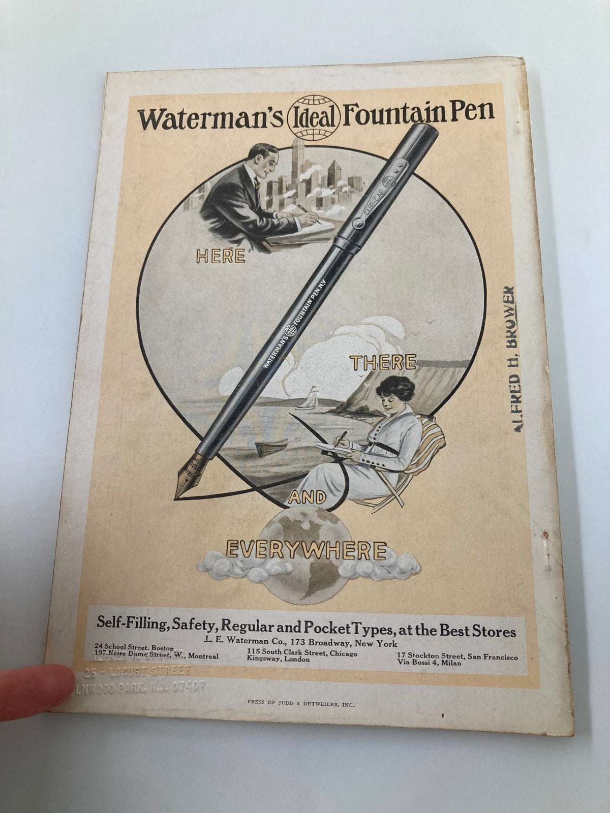 Back cover of the June 1915 issue of The National Geographic Magazine advertising Waterman's Ideal Fountain Pen, featuring artistic design and promotional text.