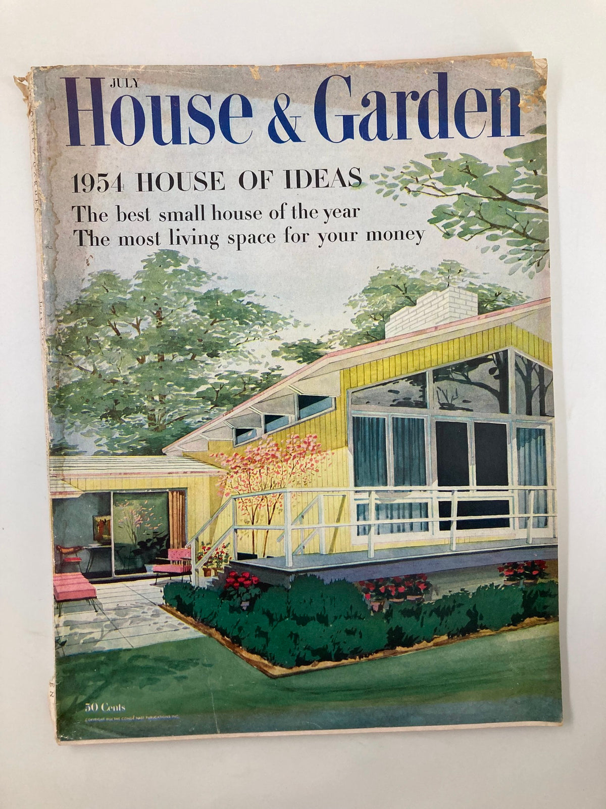 Cover of VTG House & Garden Magazine July 1954 featuring 'The Most Living Space for Your Money', showcasing a mid-century house design with lush greenery.