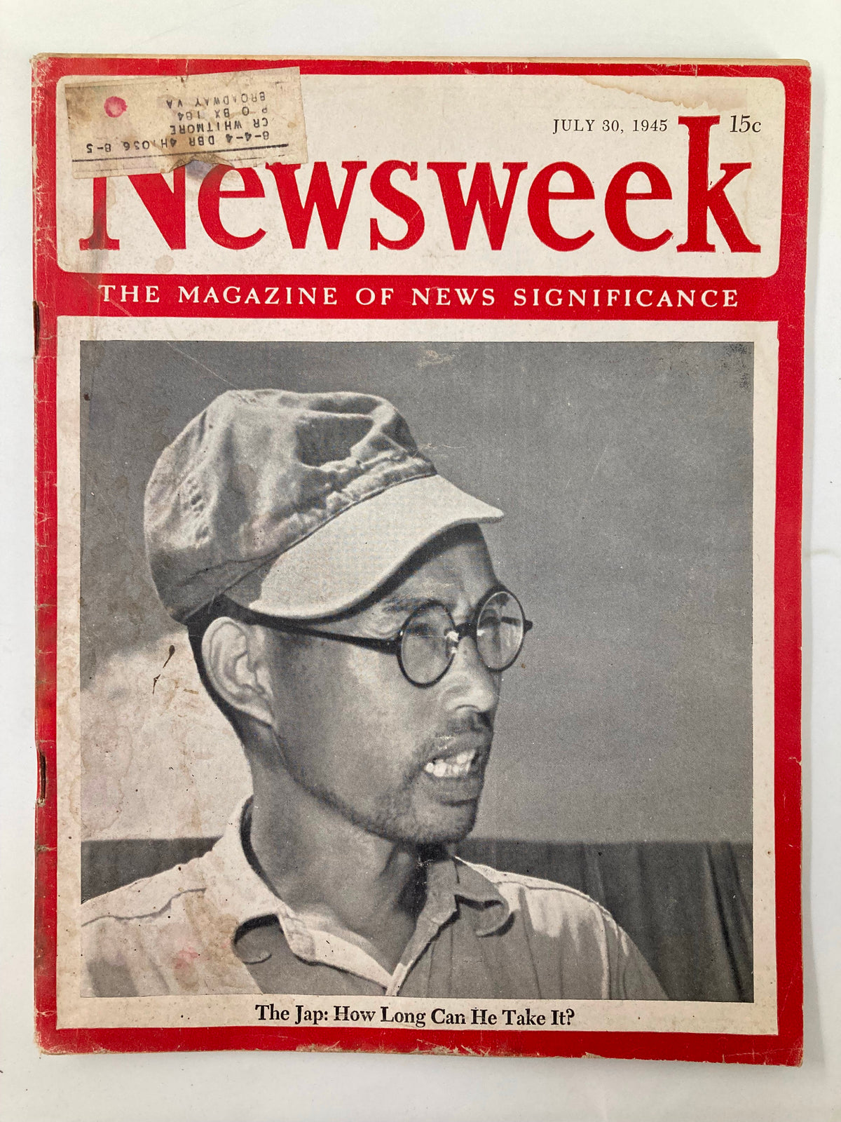 Vintage Newsweek magazine cover from July 30, 1945, featuring the title 'The Jap: How Long Can He Take It?' The magazine is highlighted by a photograph of a man in glasses and a cap, reflecting on the themes of World War II. This collectible magazine is significant for its historical context and insight into American sentiments during that era.