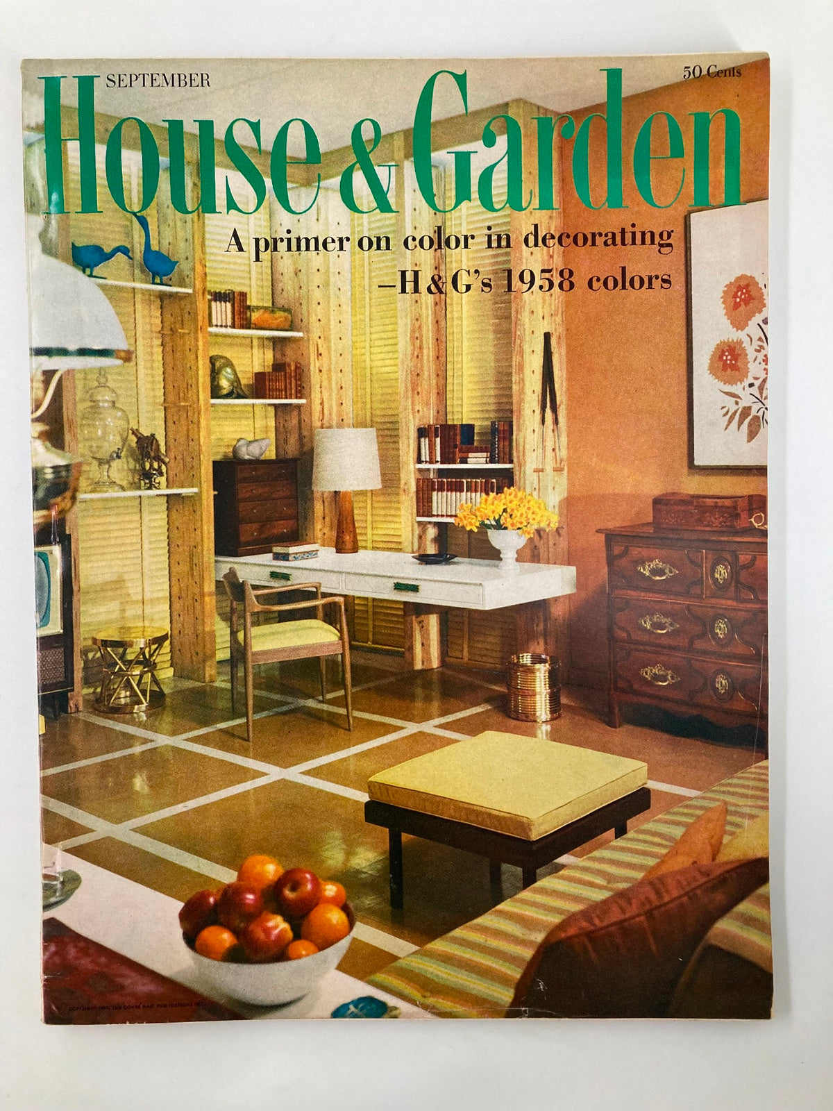 VTG House & Garden Magazine September 1957 cover showcasing a stylish living room interior. It features a cozy seating arrangement, vibrant color palette, and mid-century decor elements. Titled 'A Primer on Color in Decorating', this magazine explores color usage in home design from the 1950s.