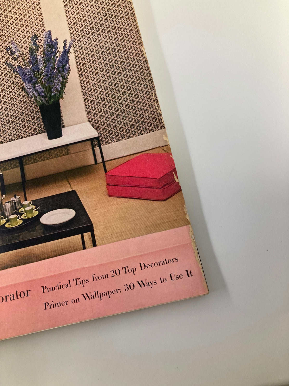 Close-up of the bottom section of the VTG House & Garden Magazine from October 1954 cover, showcasing the subtitle 'How To Be Your Own Decorator' and practical tips from top decorators.