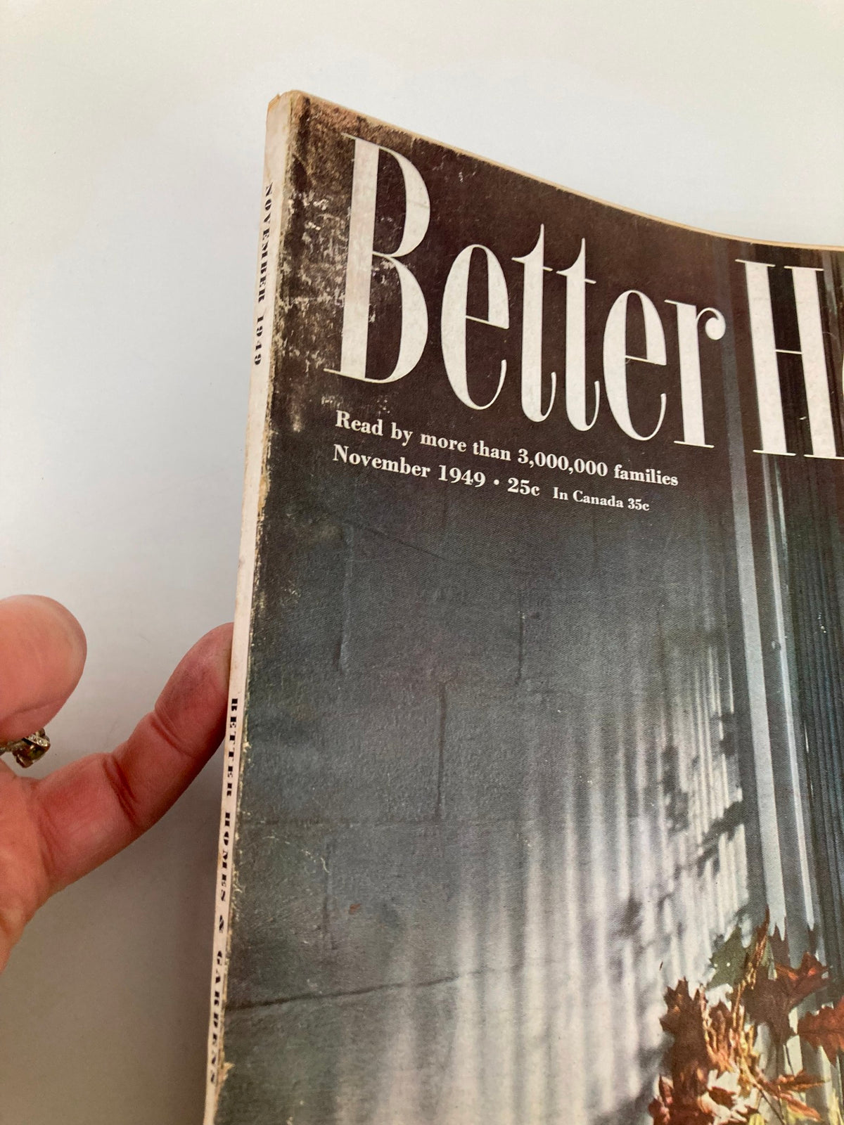 Close-up view of the VTG Better Homes & Gardens Magazine November 1949 showing the spine and edges, highlighting its vintage condition and wear.