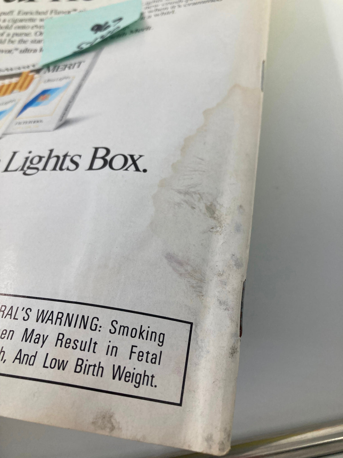 Detailed view of the back cover of the VTG Newsweek Magazine from April 25, 1988, showcasing wear and an advertisement along with a health warning note.