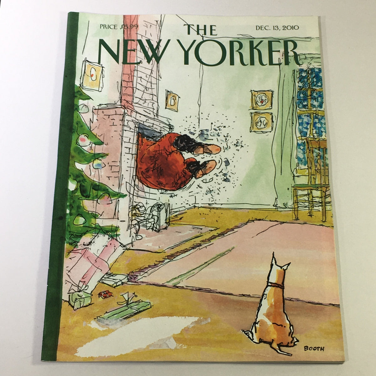 The New Yorker December 13 2010 magazine cover featuring the whimsical illustration by George Booth, depicting a festive interior scene with a cat observing a playful Santa figure.