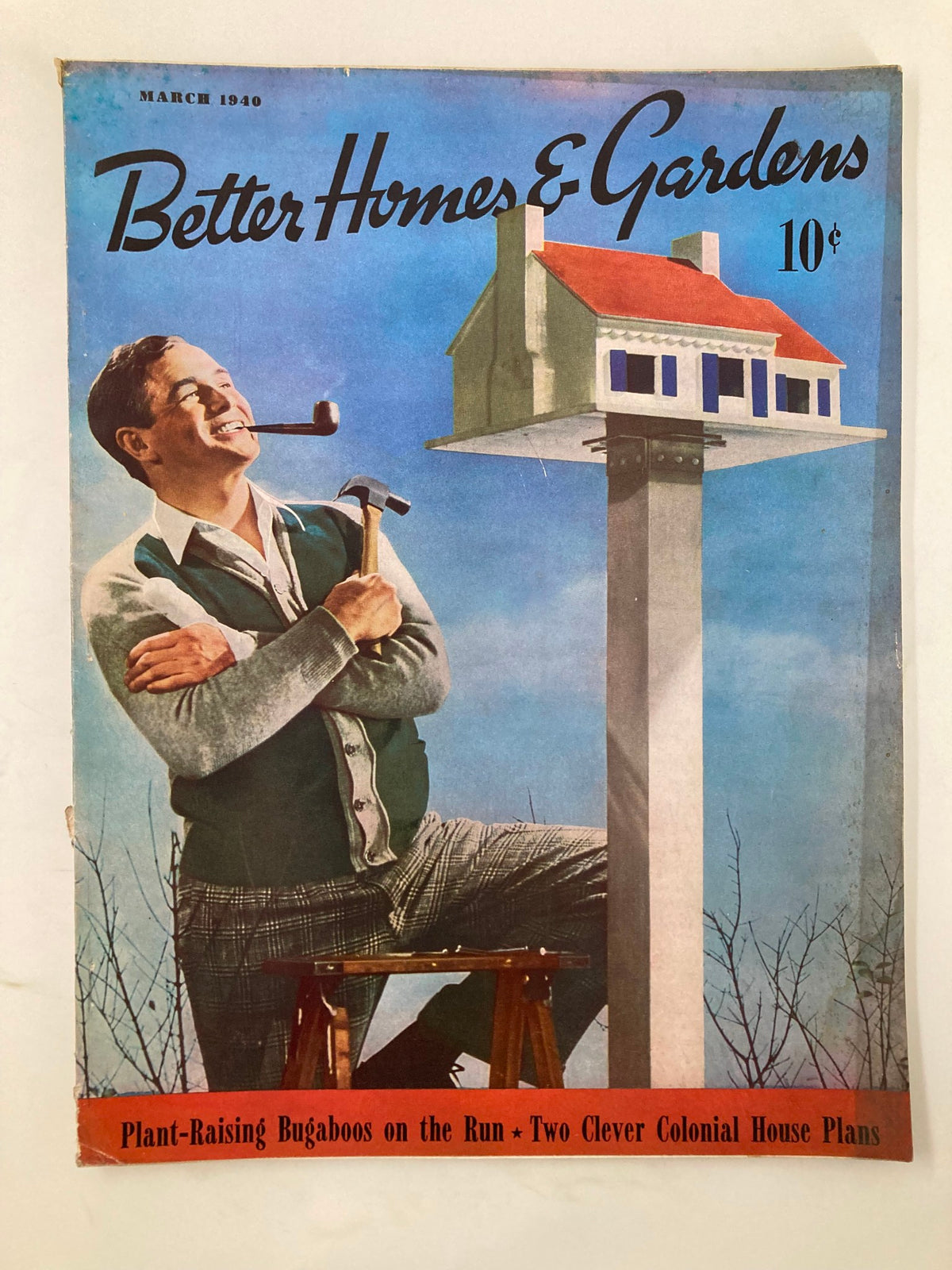 Cover of VTG Better Homes & Gardens Magazine from March 1940 featuring a smiling man with a pipe and a hammer, beside a whimsical birdhouse design, highlighting the article 'Plant-Raising Bugaboos on the Run'.