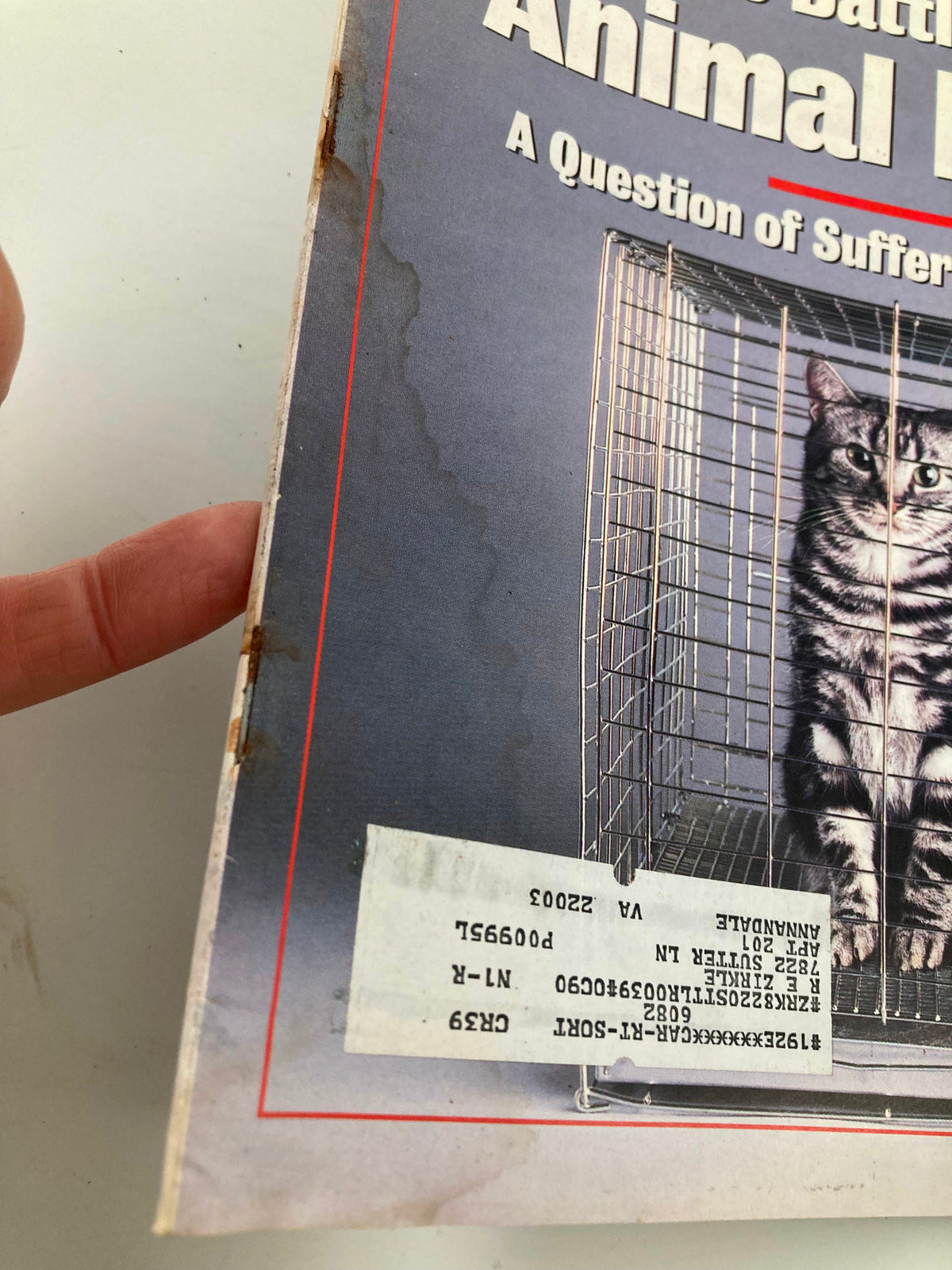 Close-up of the side of VTG Newsweek Magazine from December 26, 1988, showing cosmetic wear and the label on the cover about animal rights.