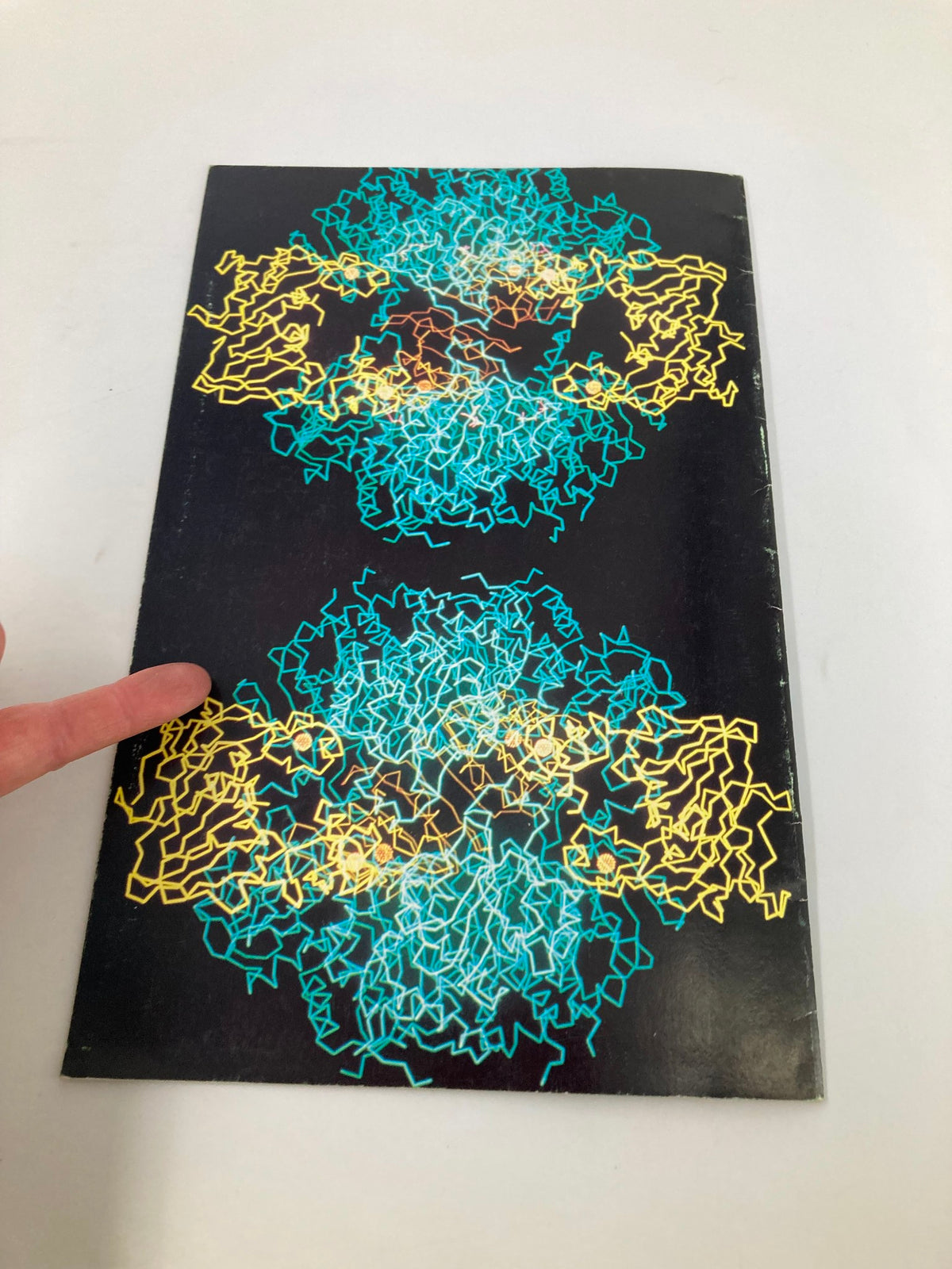 Back cover of 'Design of Life: An Exhibit of Molecular Structure', showcasing a colorful artistic representation of molecular structures.