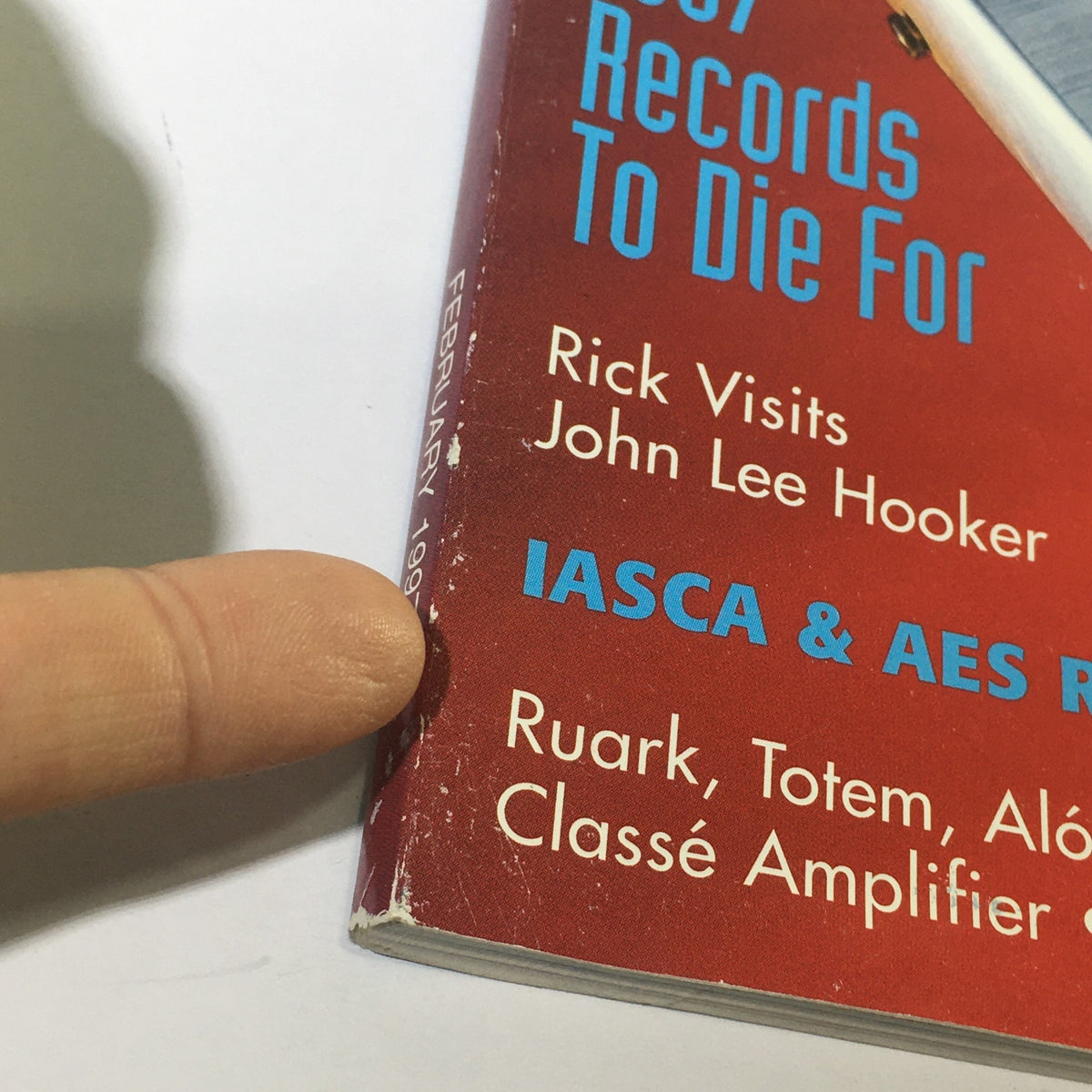 Close-up view of the spine of Stereophile Magazine February 1997, emphasizing details such as the publication date and notable articles including John Lee Hooker.