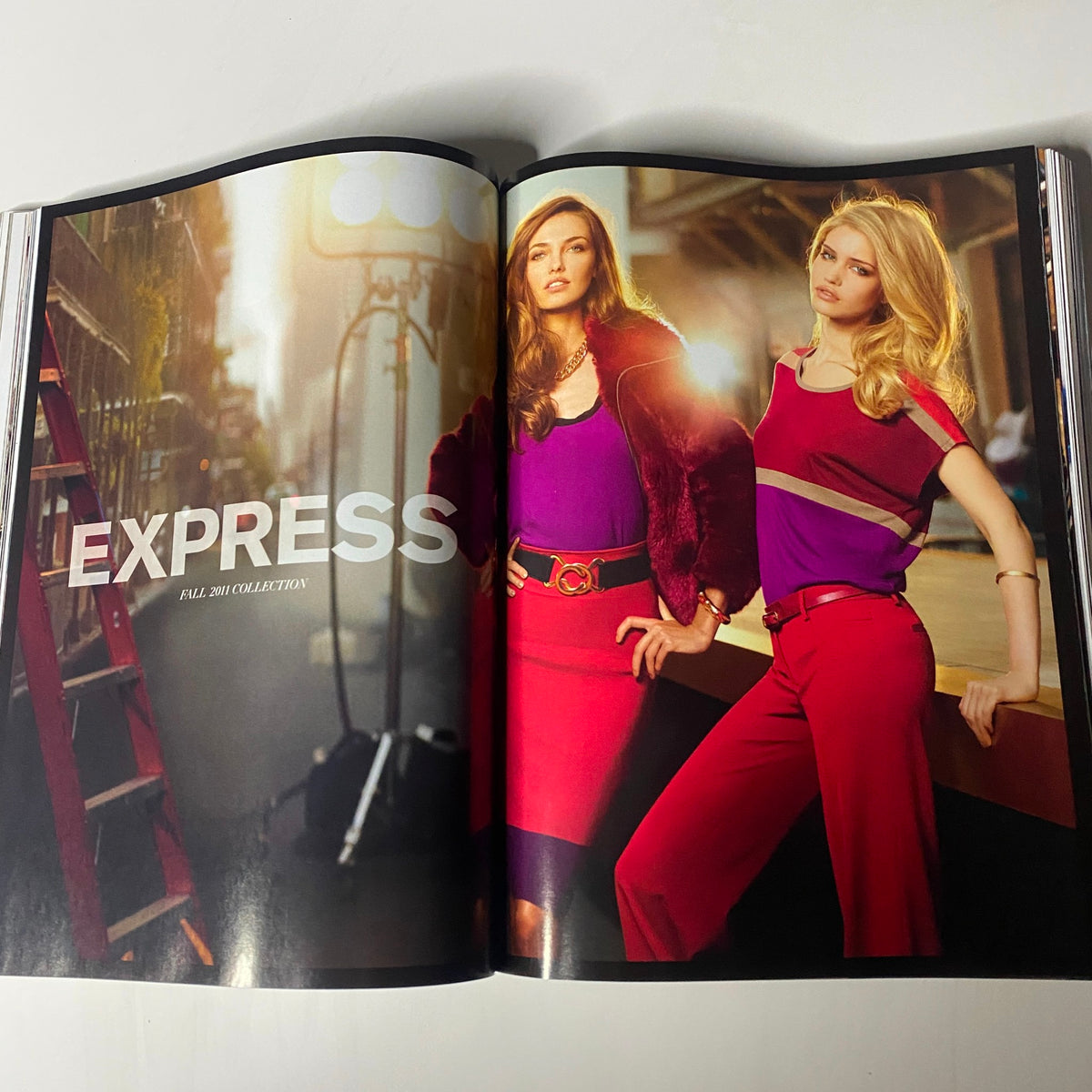Vogue Magazine September 2011 Kate Moss Cover showcasing two models in stylish Fall outfits, emphasizing vibrant colors for the Express Fall 2011 Collection.