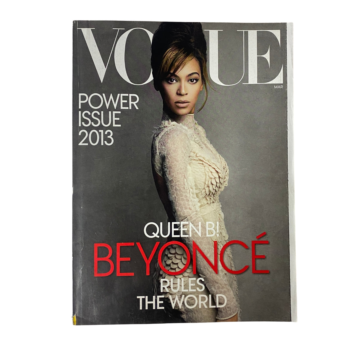Vogue Magazine March 2013 featuring Beyoncé Knowles on the cover, highlighted as 'Queen B! Beyoncé Rules the World.' The cover showcases her in a stunning Givenchy Haute Couture dress, emphasizing the power issue of the magazine.