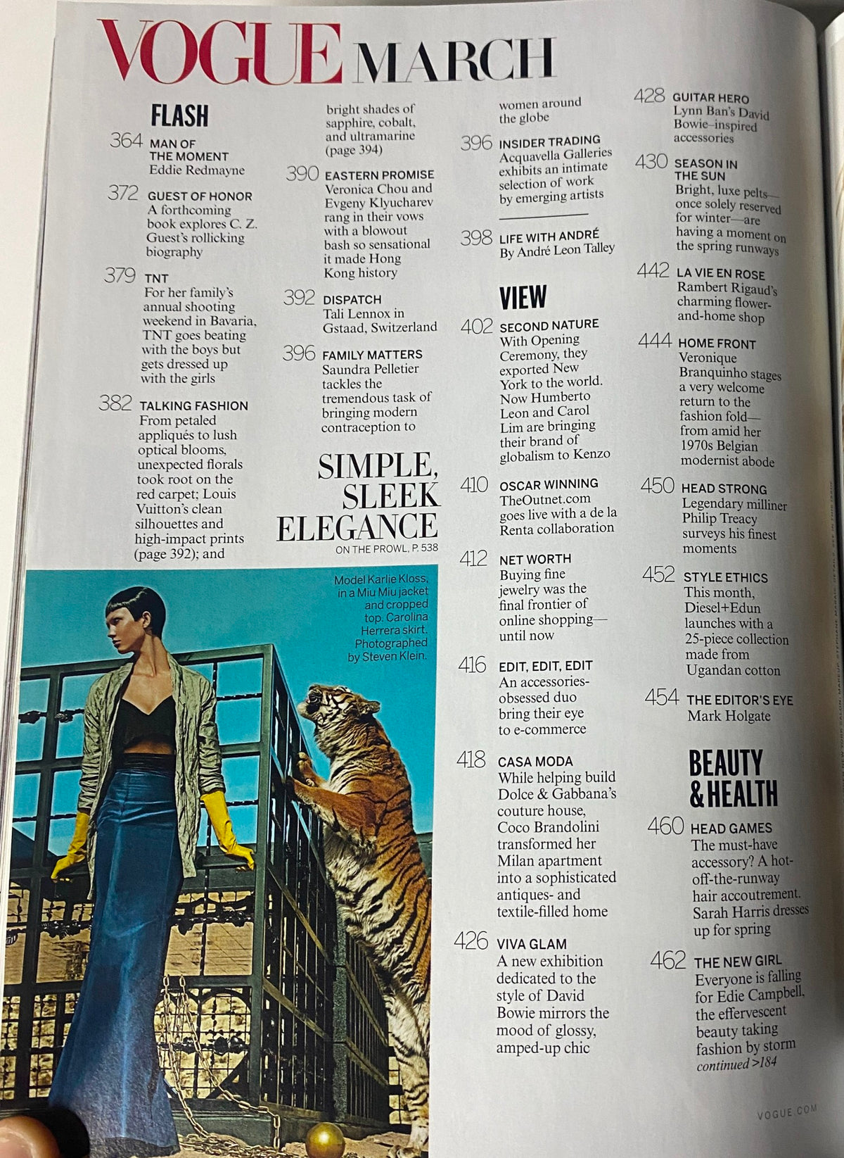 Interior page of Vogue Magazine March 2013 featuring fashion highlights, including the section labeled 'Simple, Sleek Elegance' alongside a stylish model with a tiger.