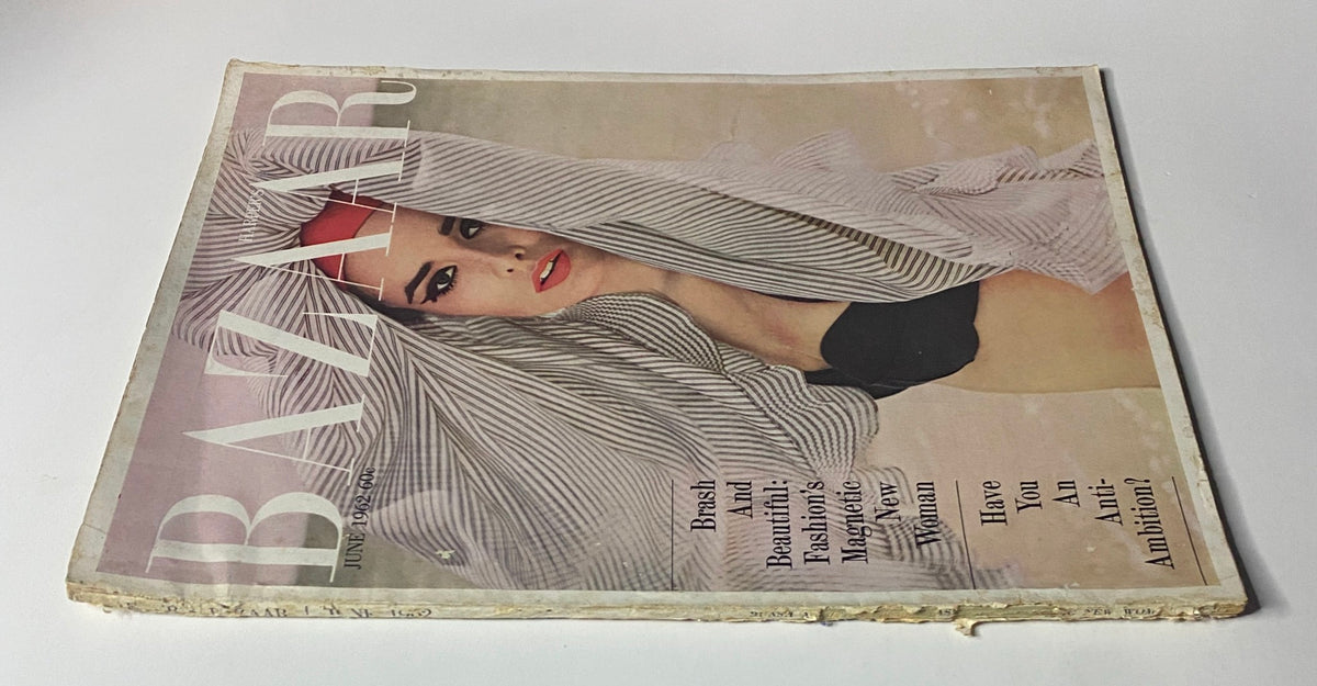 Harper's Bazaar Magazine June 1962 showcasing the cover 'Brash And Beautiful! Fashion's Magnetic New Woman'. The image highlights a model posing with bold makeup and a striped head wrap, epitomizing vintage summer style.