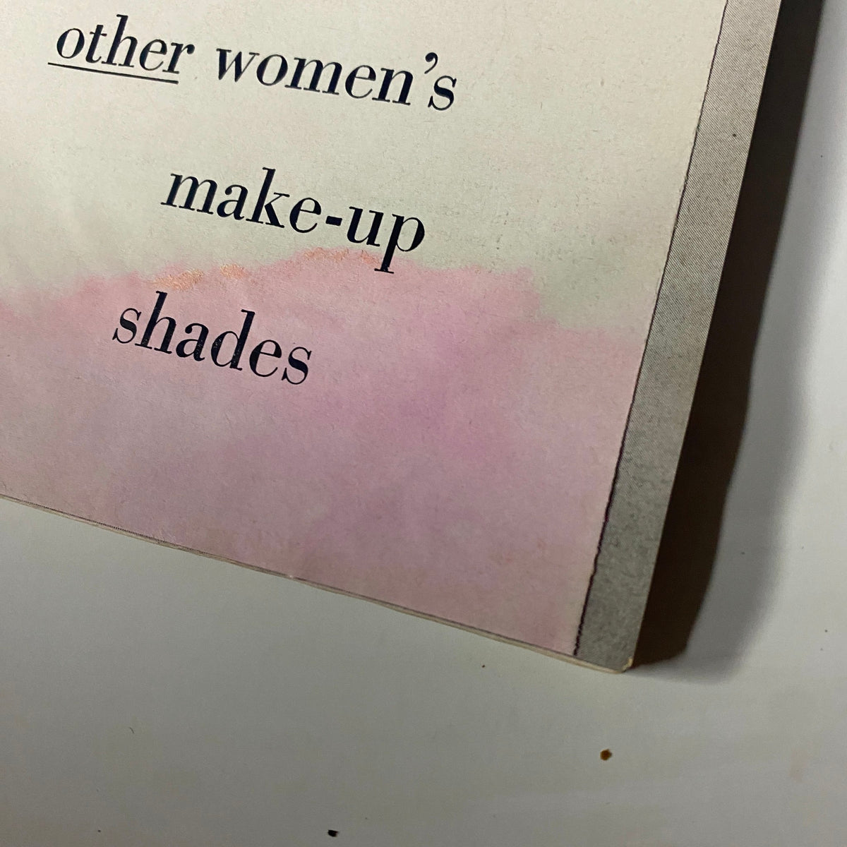 Close-up of a page on women's makeup shades from Harper's Bazaar Magazine December 1960, focusing on beauty trends.
