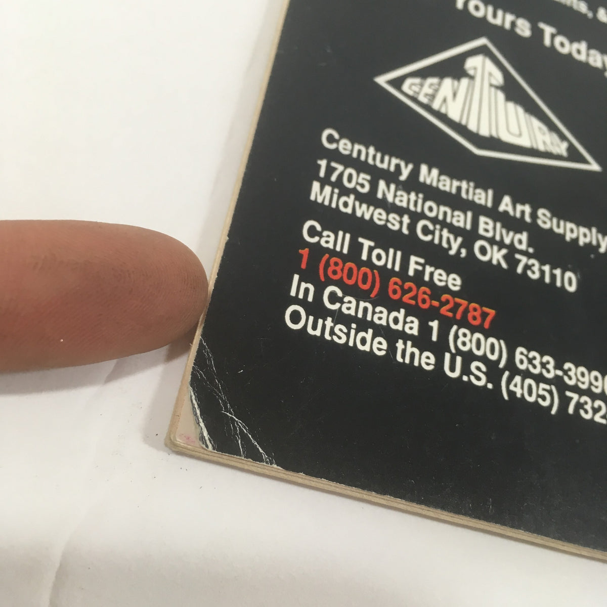 Detailed view of the back cover of Karate Kung Fu Illustrated magazine, highlighting contact information for Century Martial Art Supply and promotional offers.