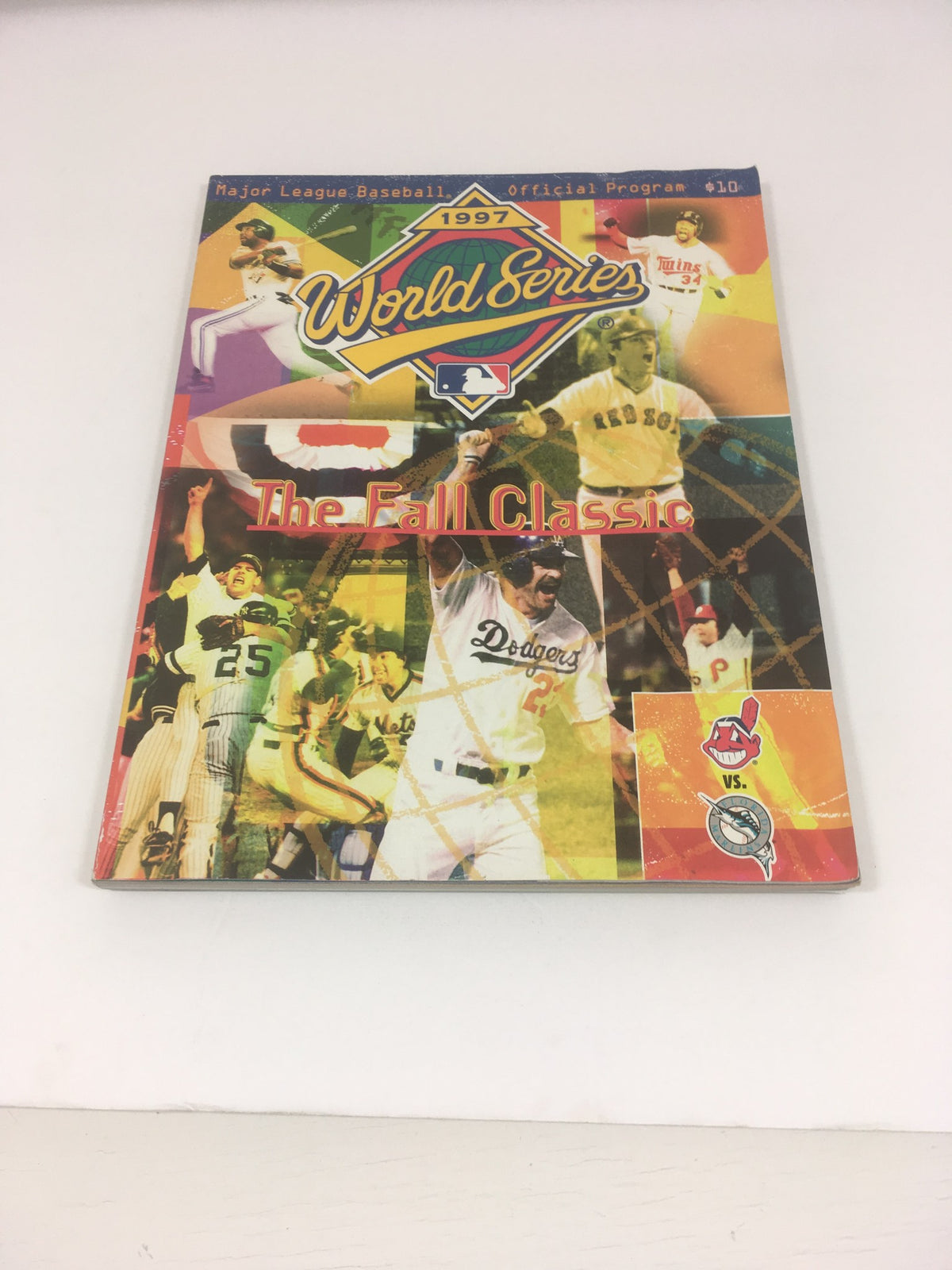 1997 World Series Major League Basketball Official Program cover featuring vibrant images of players and teams from the Fall Classic.