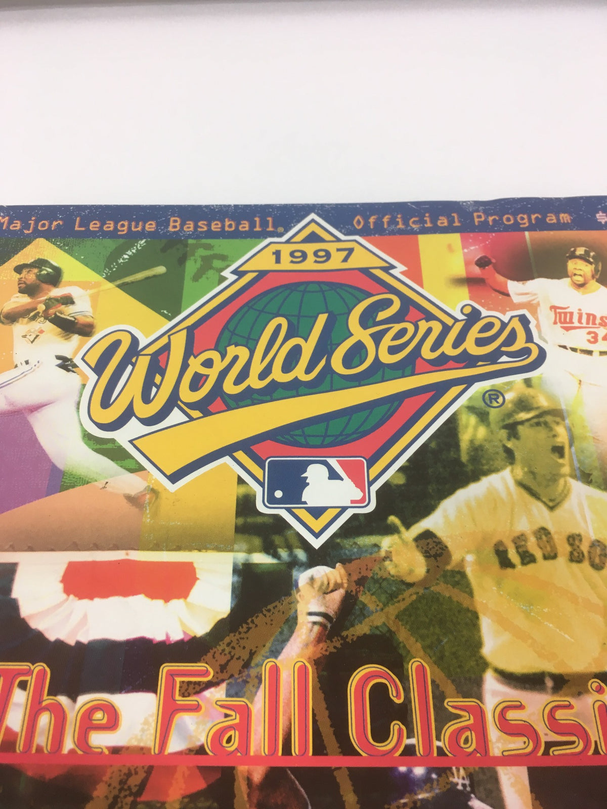 Detailed view of the 1997 World Series Major League Basketball Official Program highlighting the title and graphics.