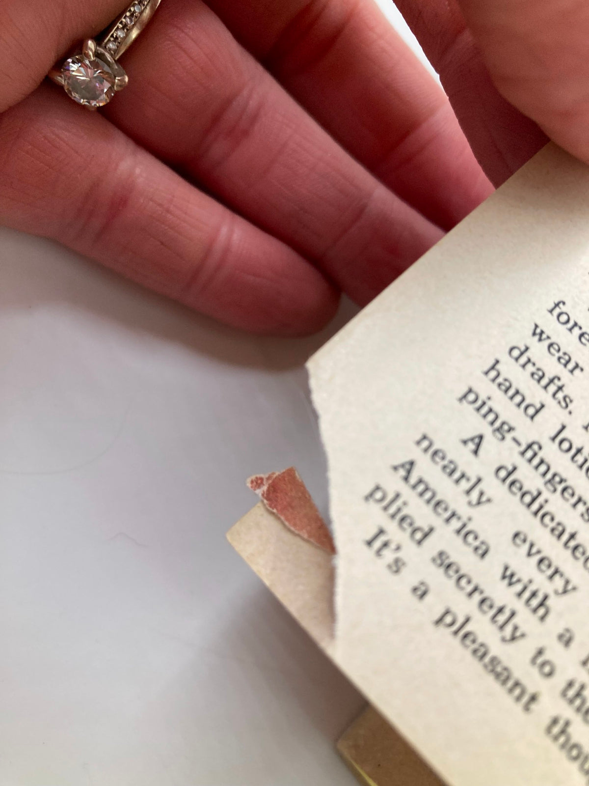 Close-up view showing minor damage to the page of the TV Guide Magazine May 3, 1958, highlighting the vintage condition of this collectible item.