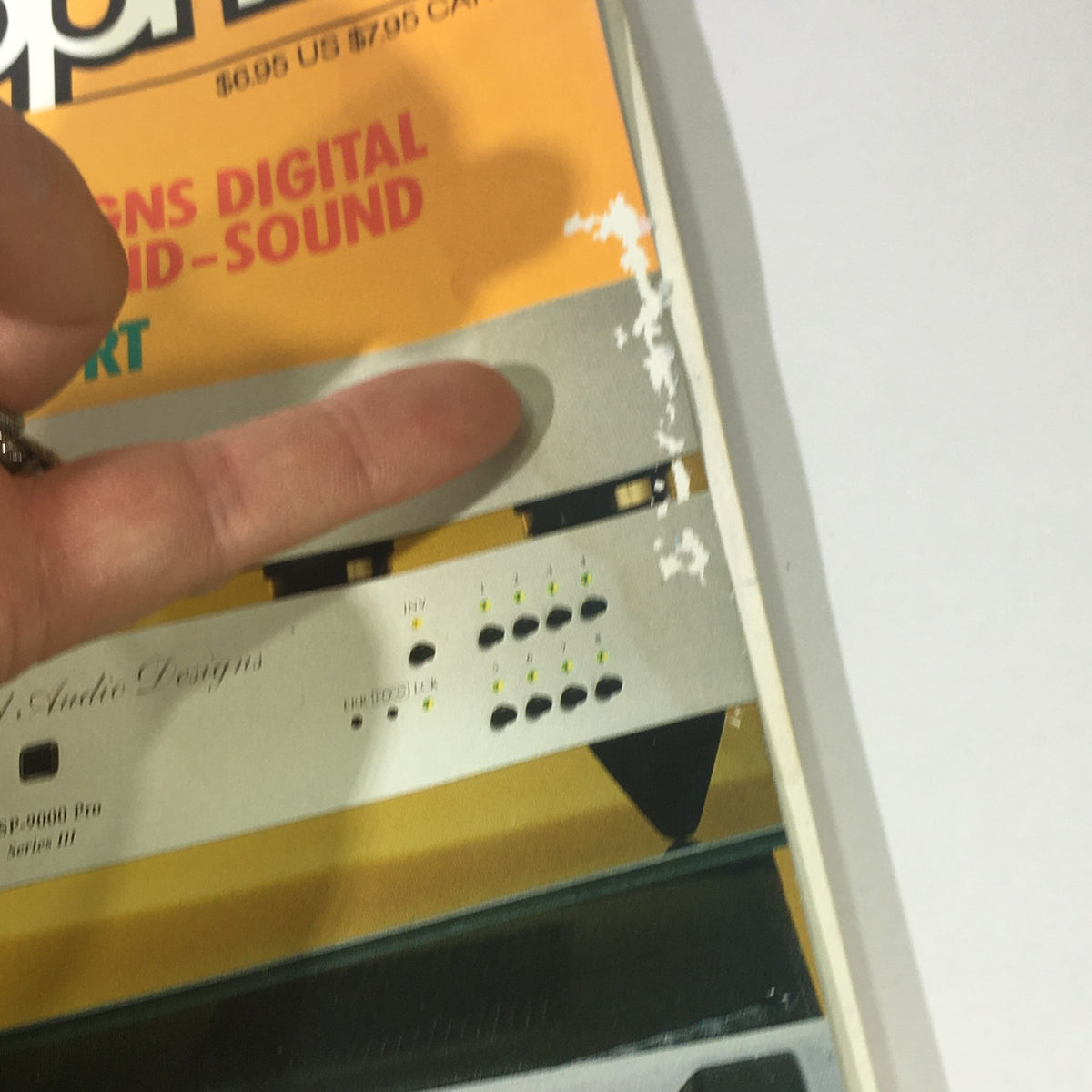 Close-up image of the top edge of Stereophile Magazine August 1995 showing minor wear. The magazine features an interview with James Levine and discusses Audio Alchemy AMP.