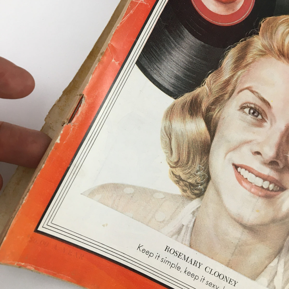 Close-up view of the cover of Time Magazine February 23, 1953, displaying singer Rosemary Clooney's portrait and the tagline, 'Keep it simple, keep it sexy, keep it sad.'