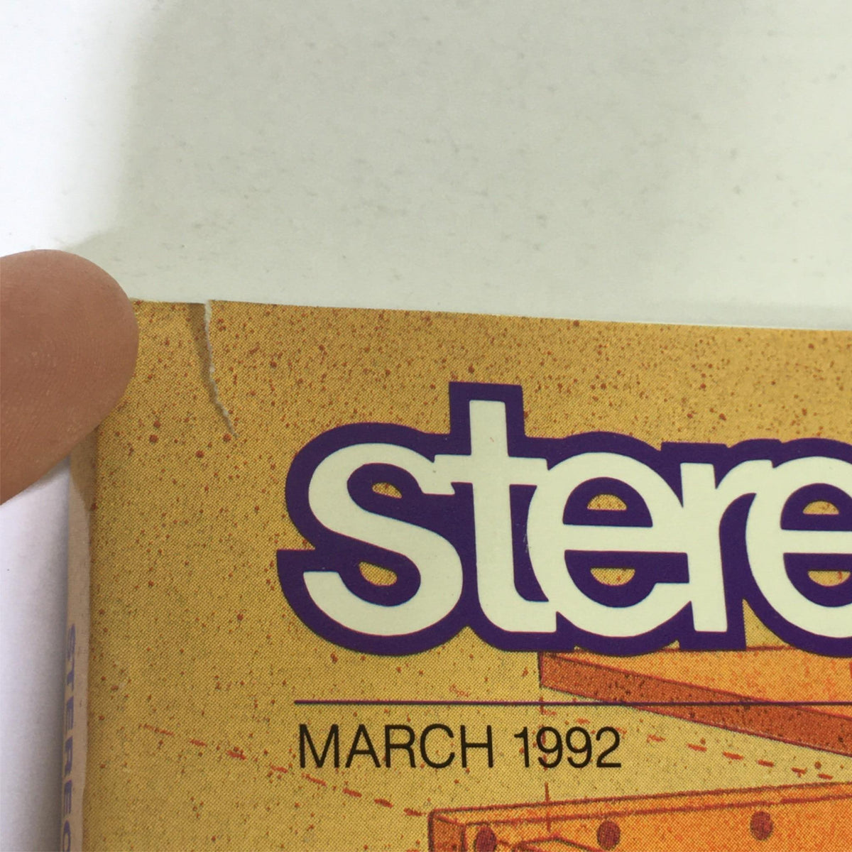 Close-up of the corner of Stereophile Magazine March 1992, showing minor damage and publication date.